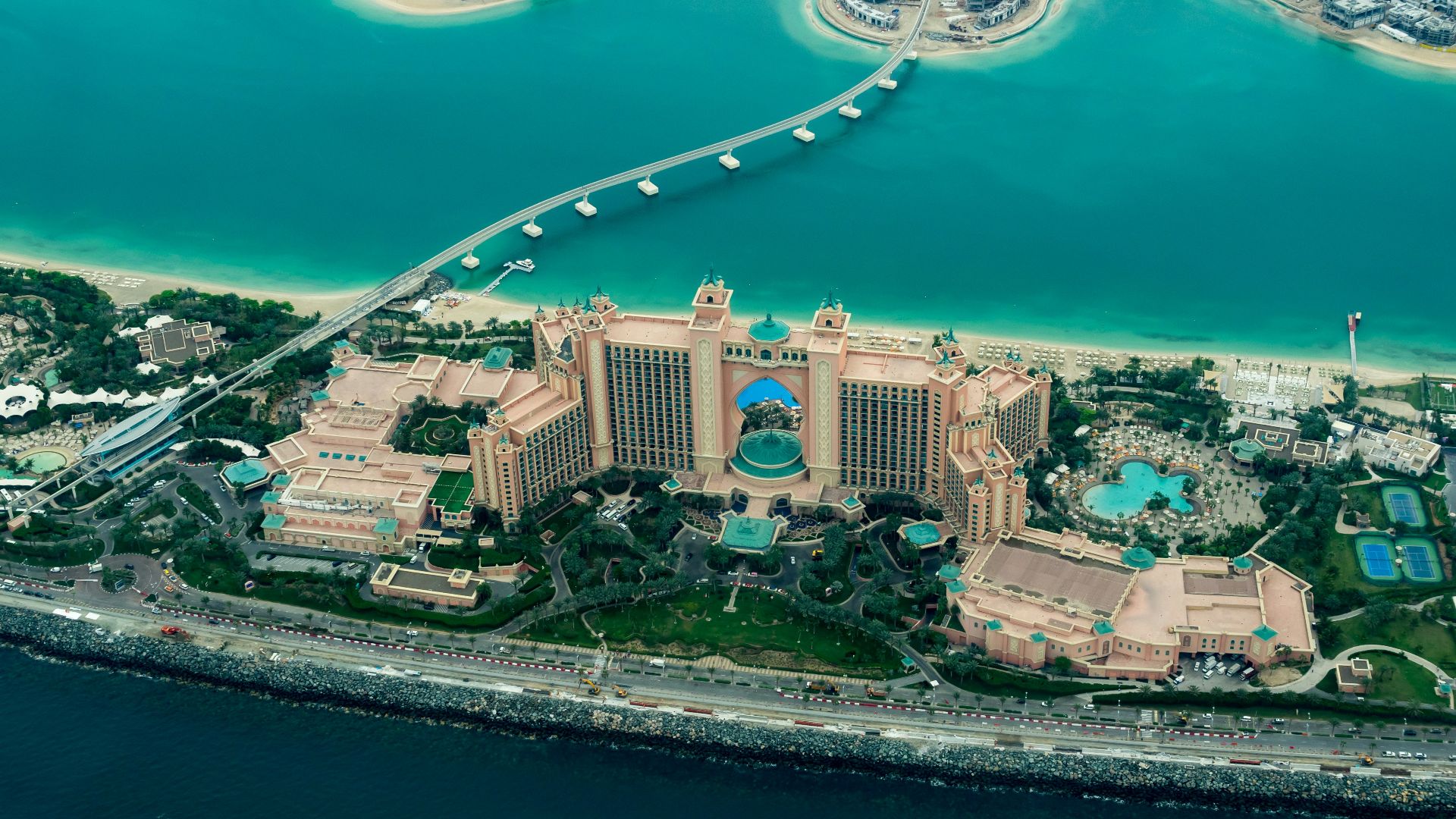 aerial photography of concrete buildings on the middle of the sea