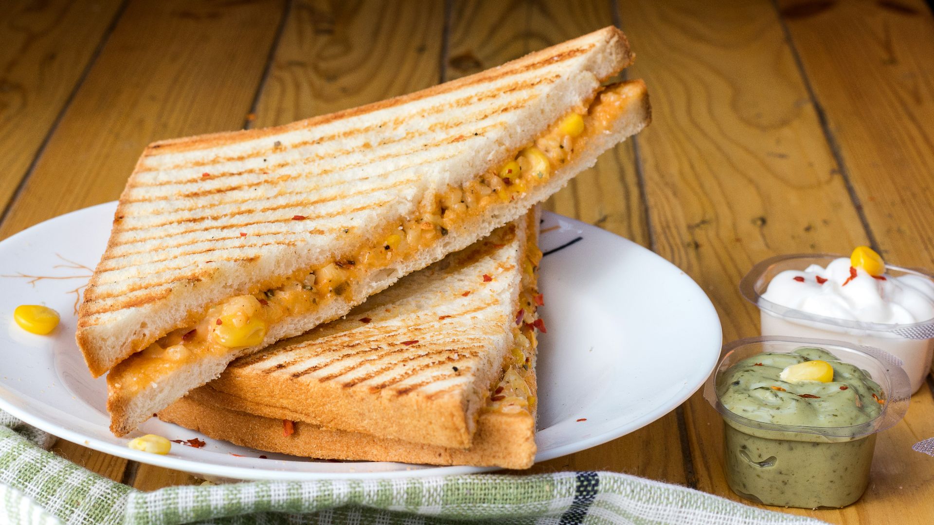 bread with cheese fillings on white ceramic plate