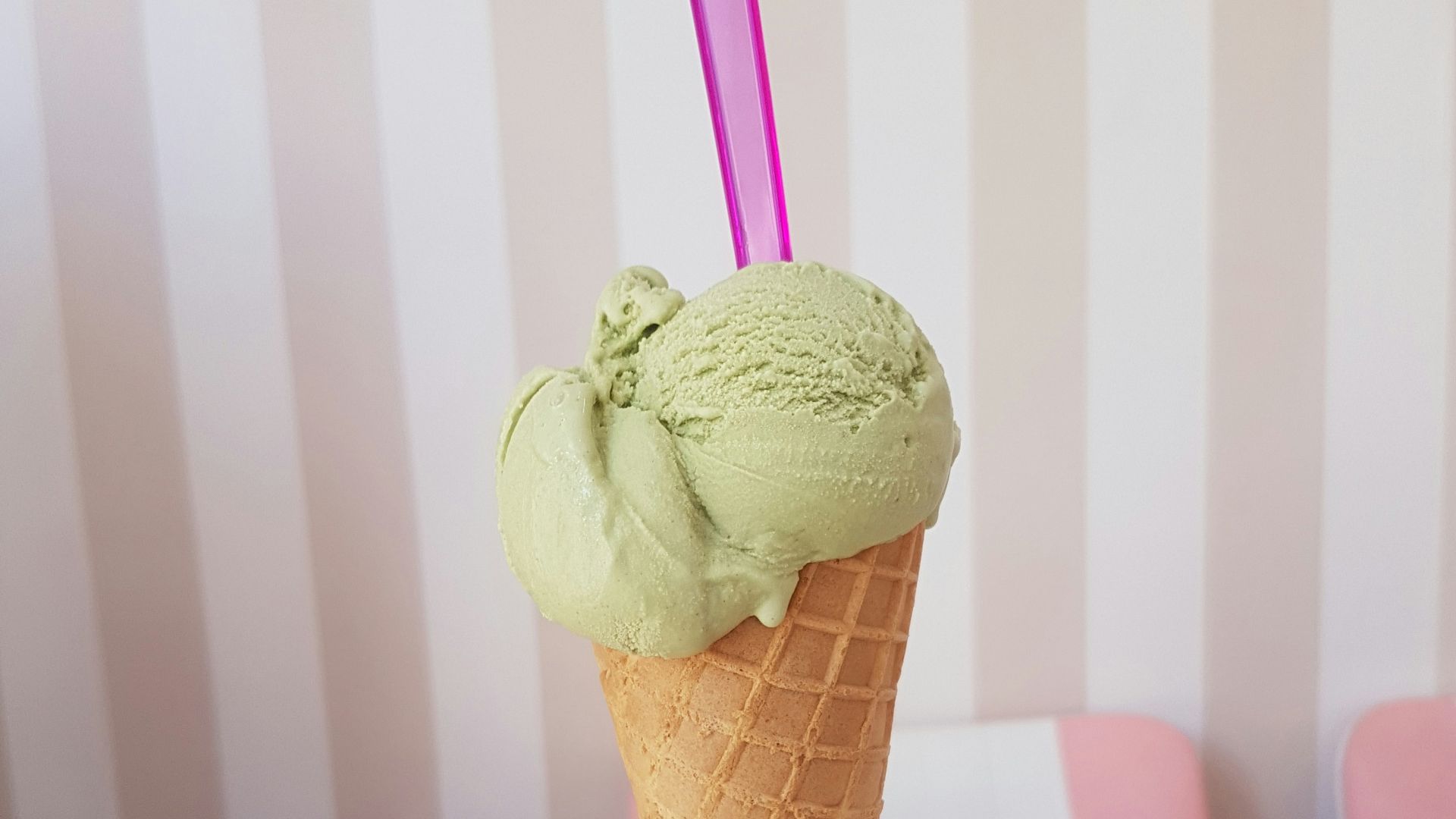 woman holding green ice cream