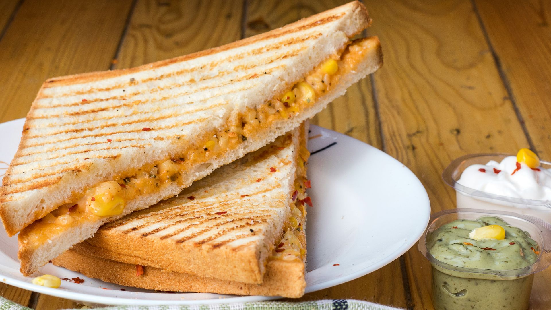 bread with cheese fillings on white ceramic plate