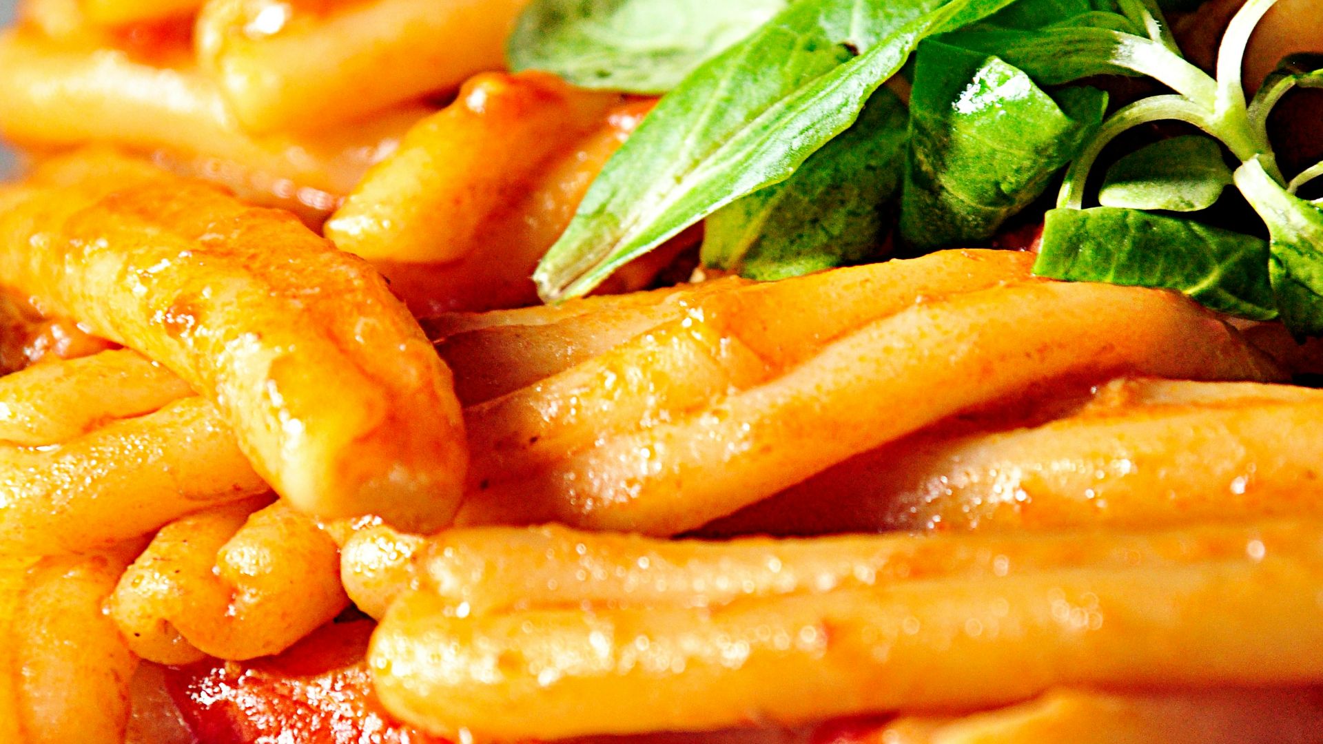 pasta with sauce and leafy greens