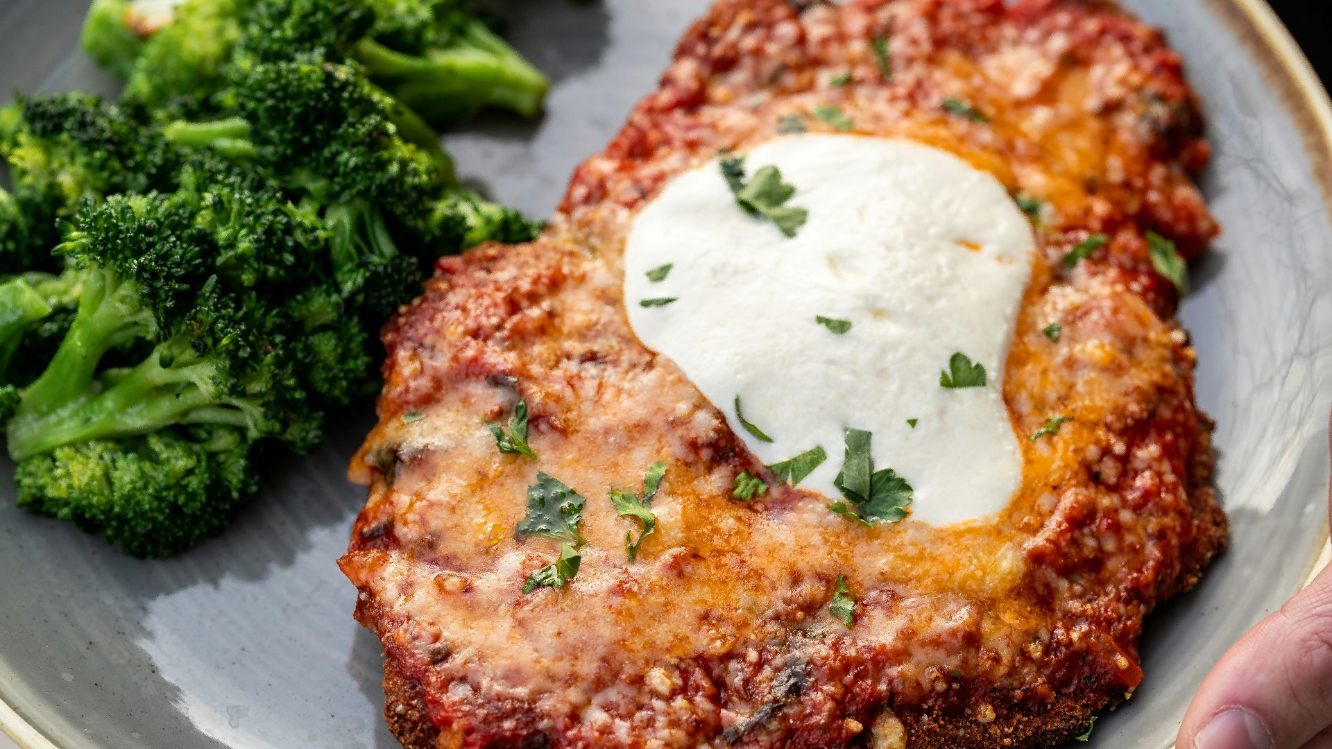 a plate of food with meat and broccoli