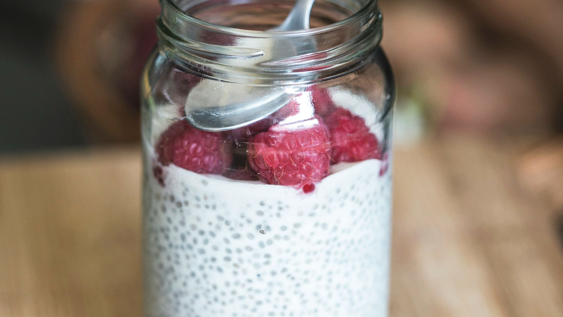 red cherries on clear glass bowl