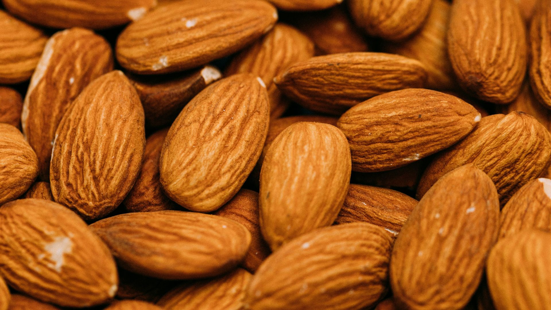 a pile of almonds sitting on top of each other