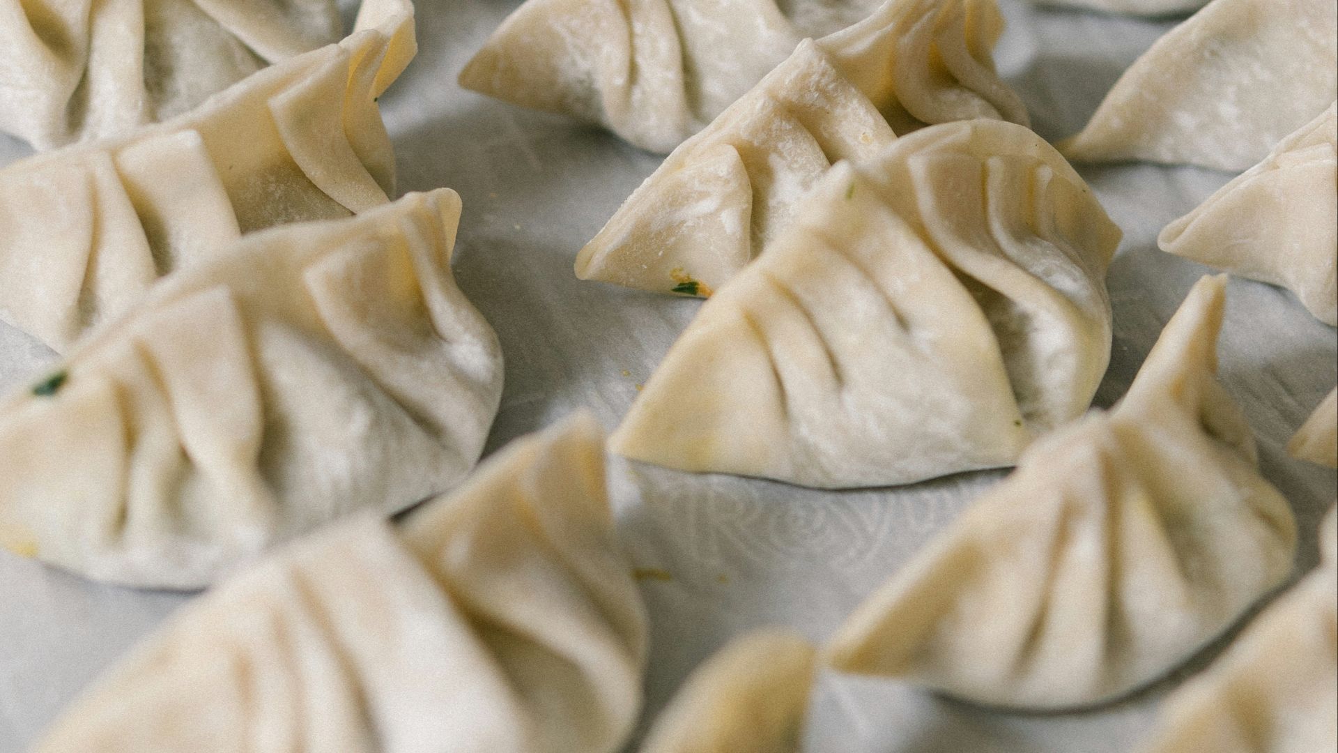 white textile on brown wooden table