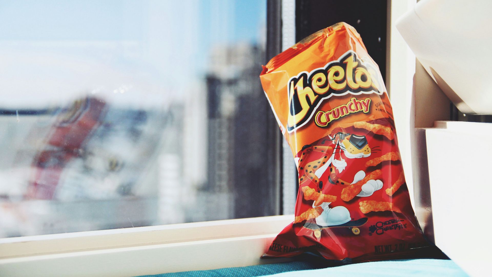 orange and yellow plastic pack on white table