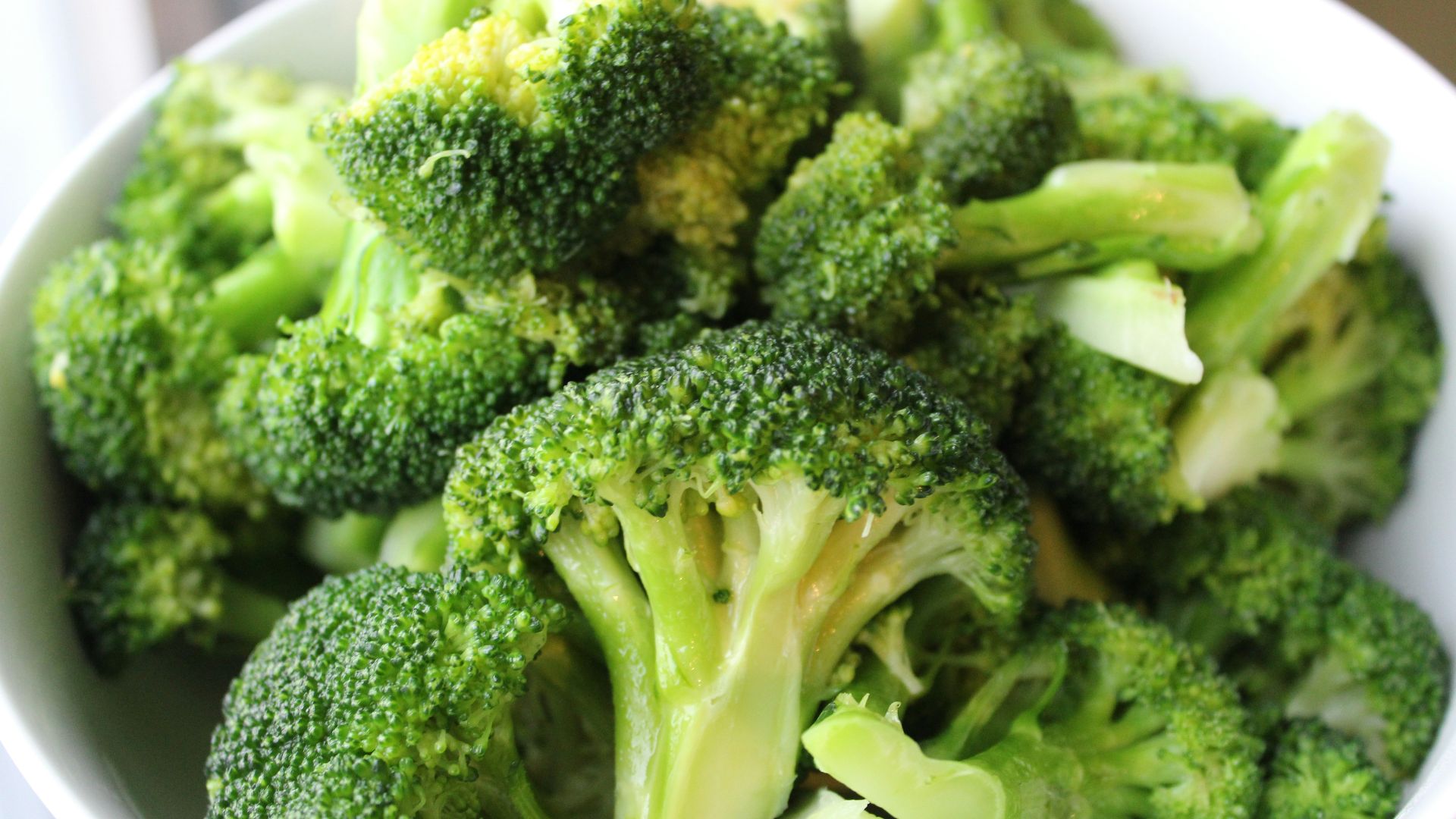 green broccoli on white ceramic plate