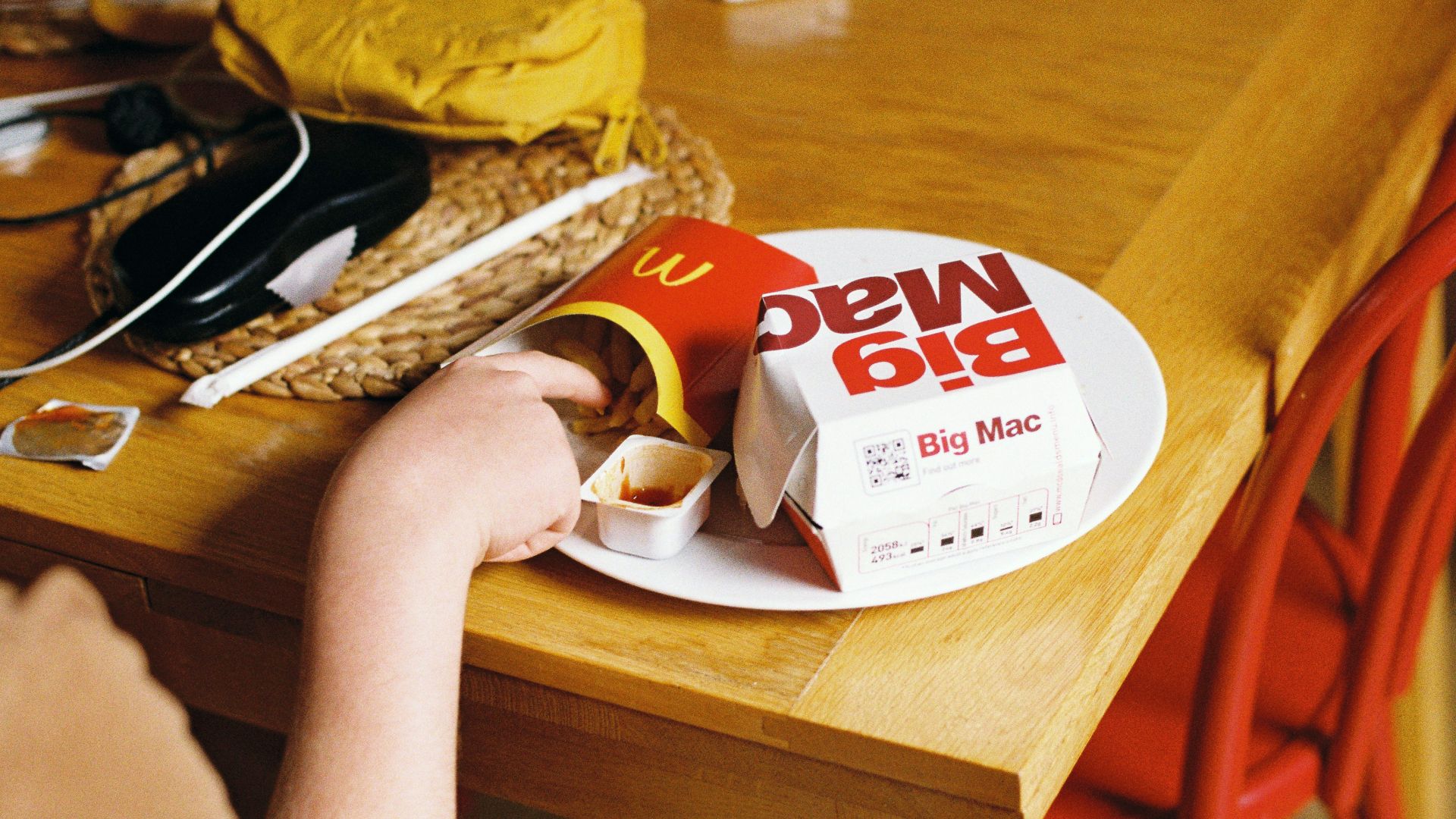 a person holding a box of cookies