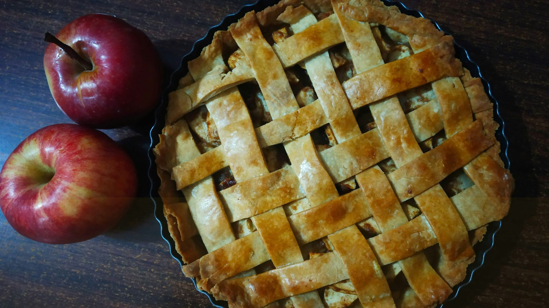 red apple beside brown pie