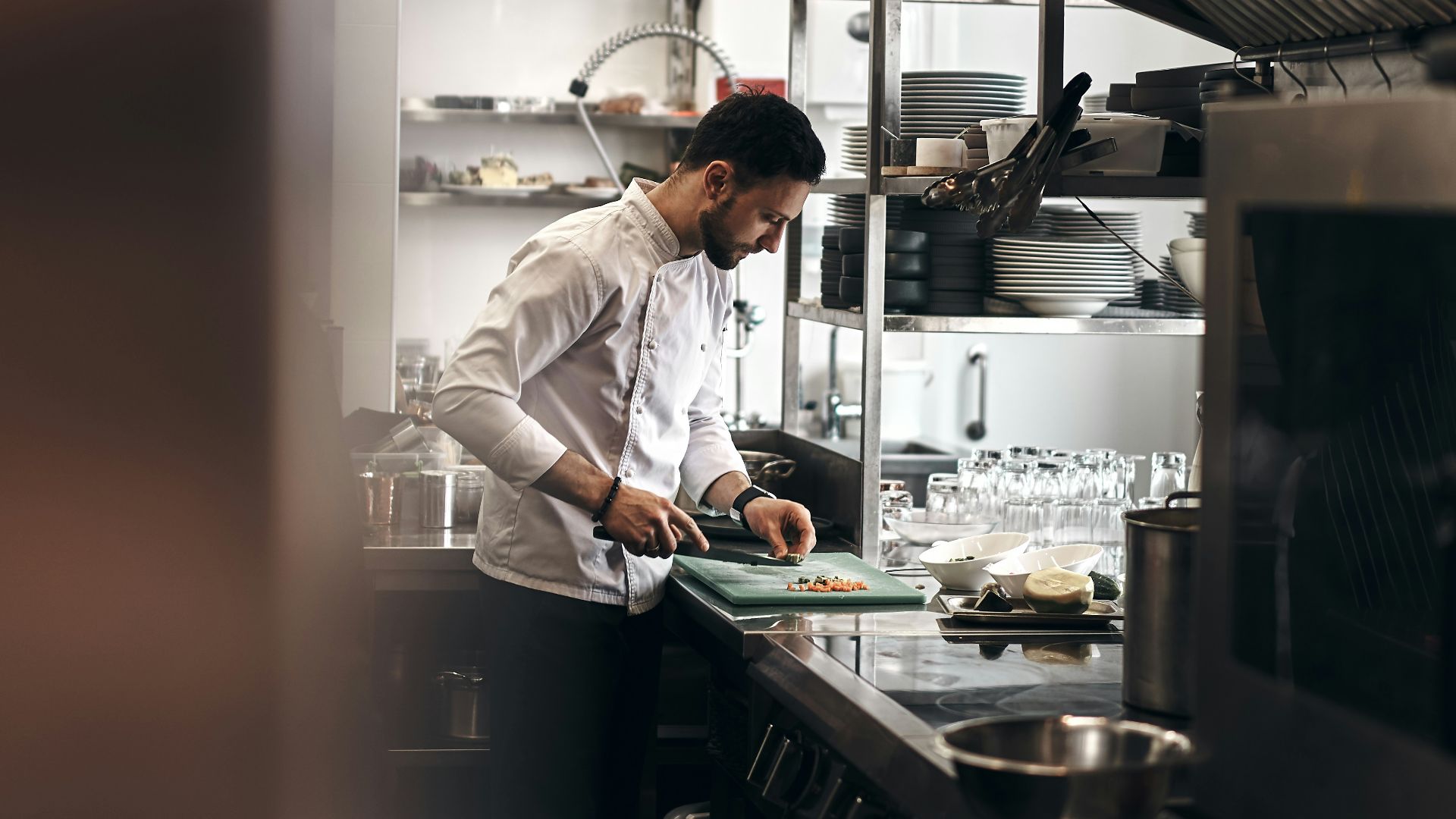 man in white dress shirt holding white ceramic plate