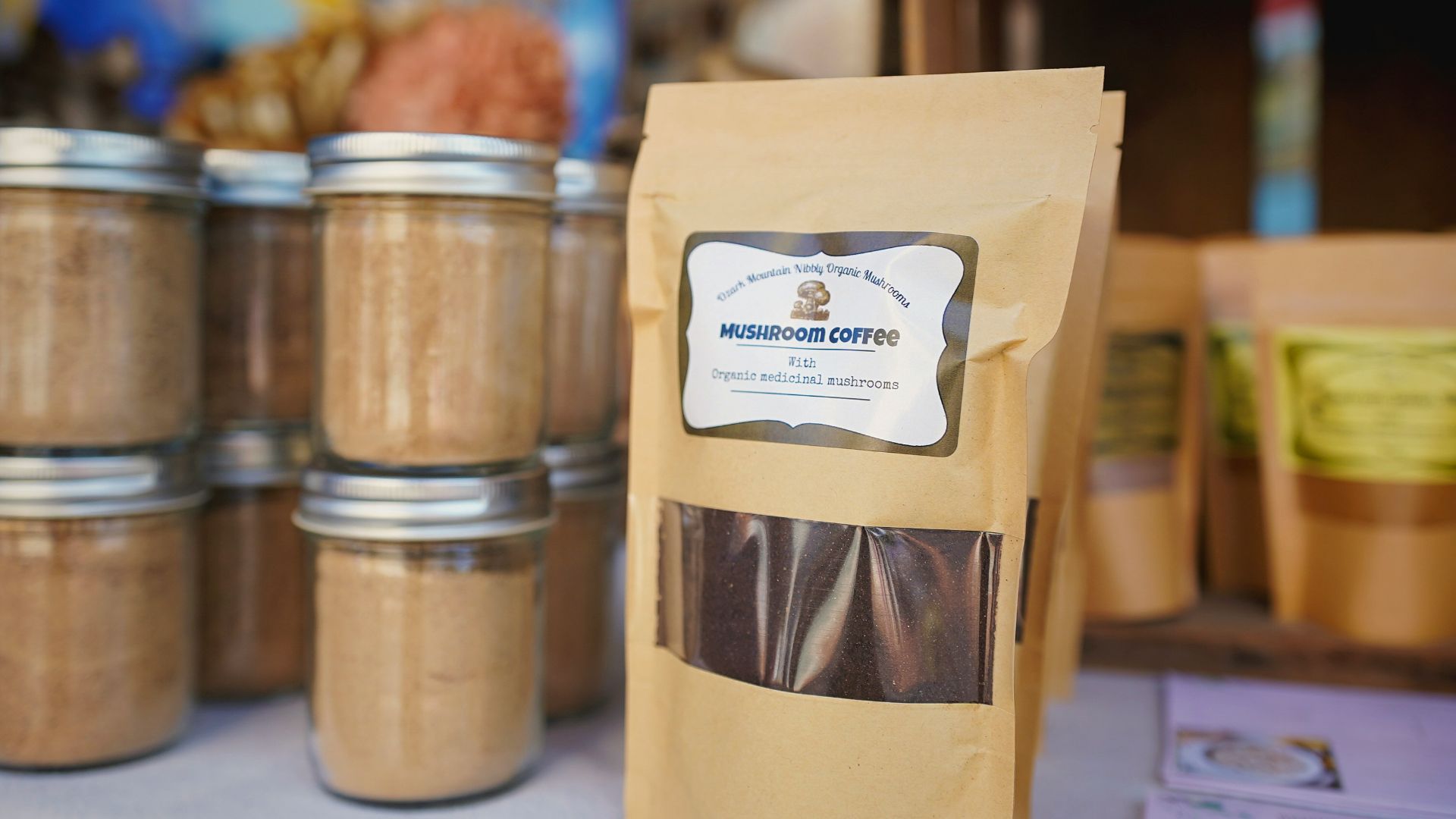 A table topped with lots of jars filled with food