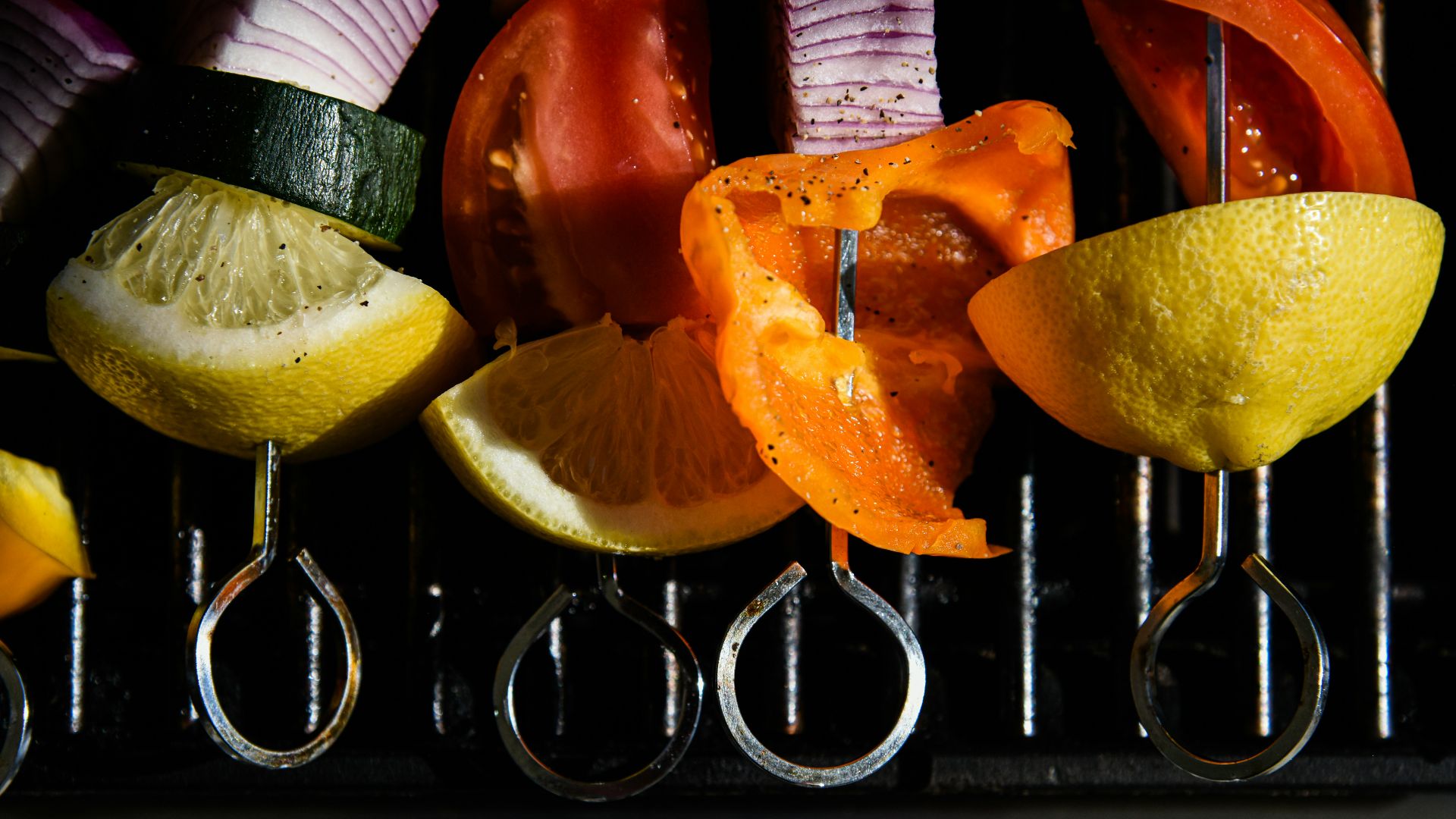 sliced orange fruit on black surface