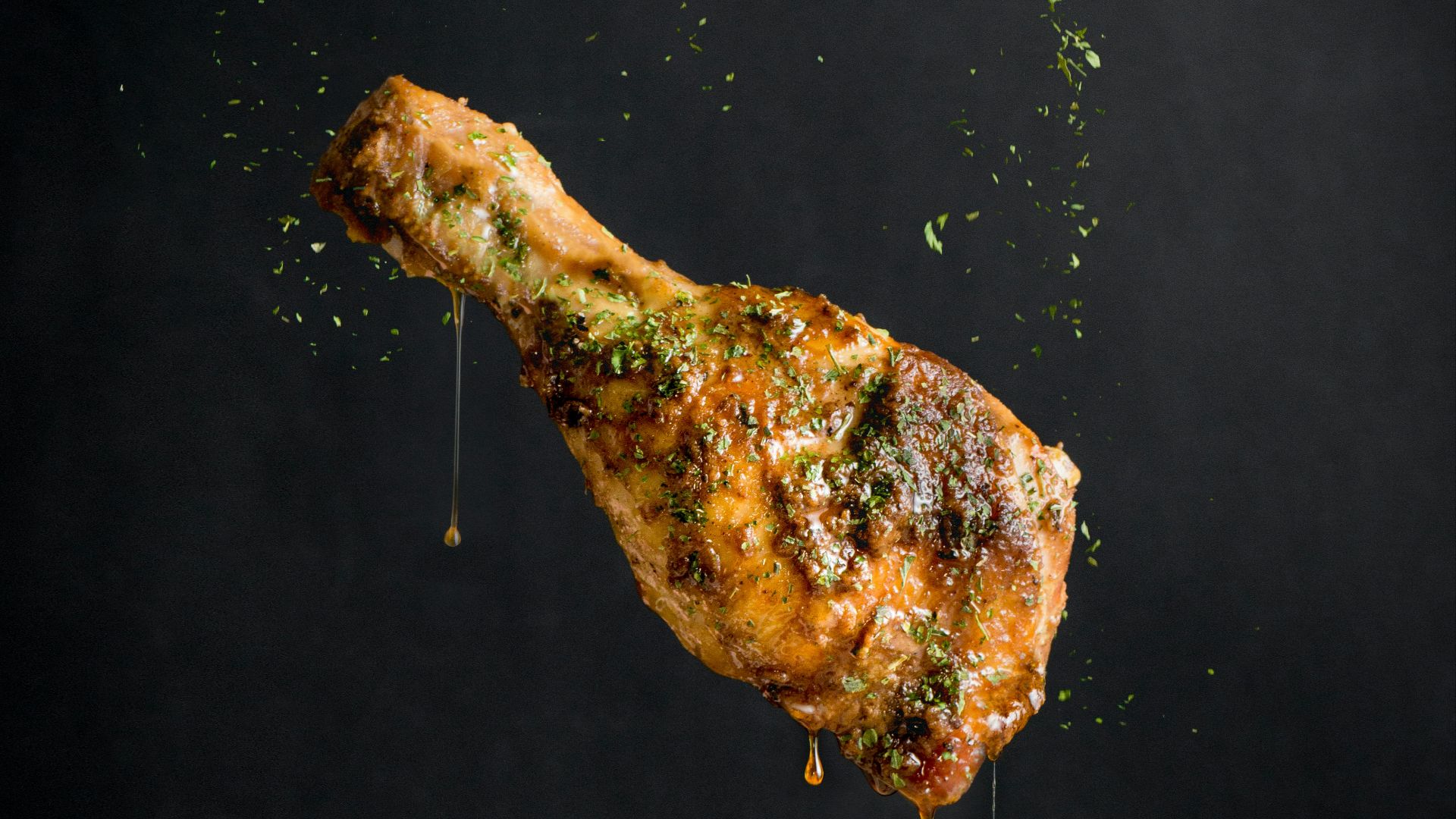 a piece of meat with sprinkles on it