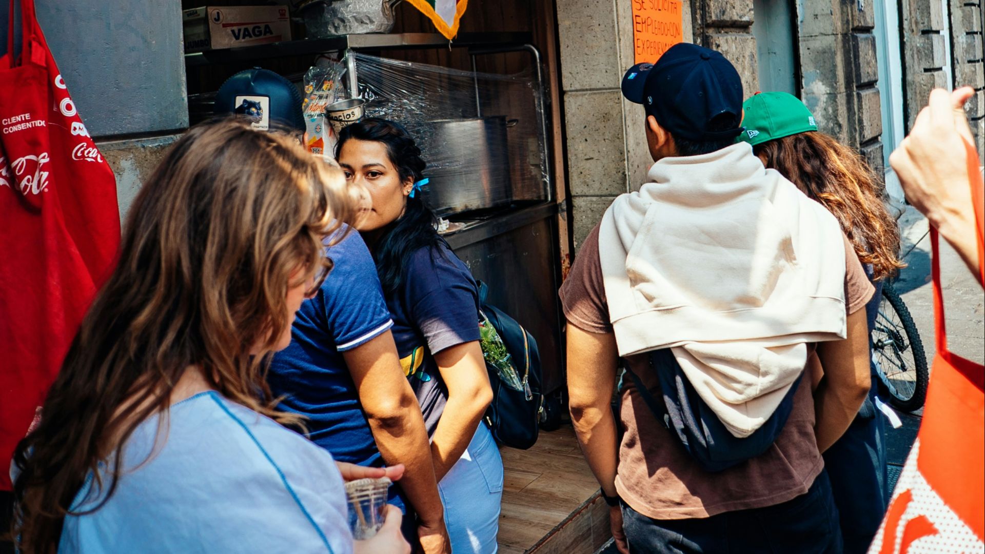 a group of people standing outside of a building