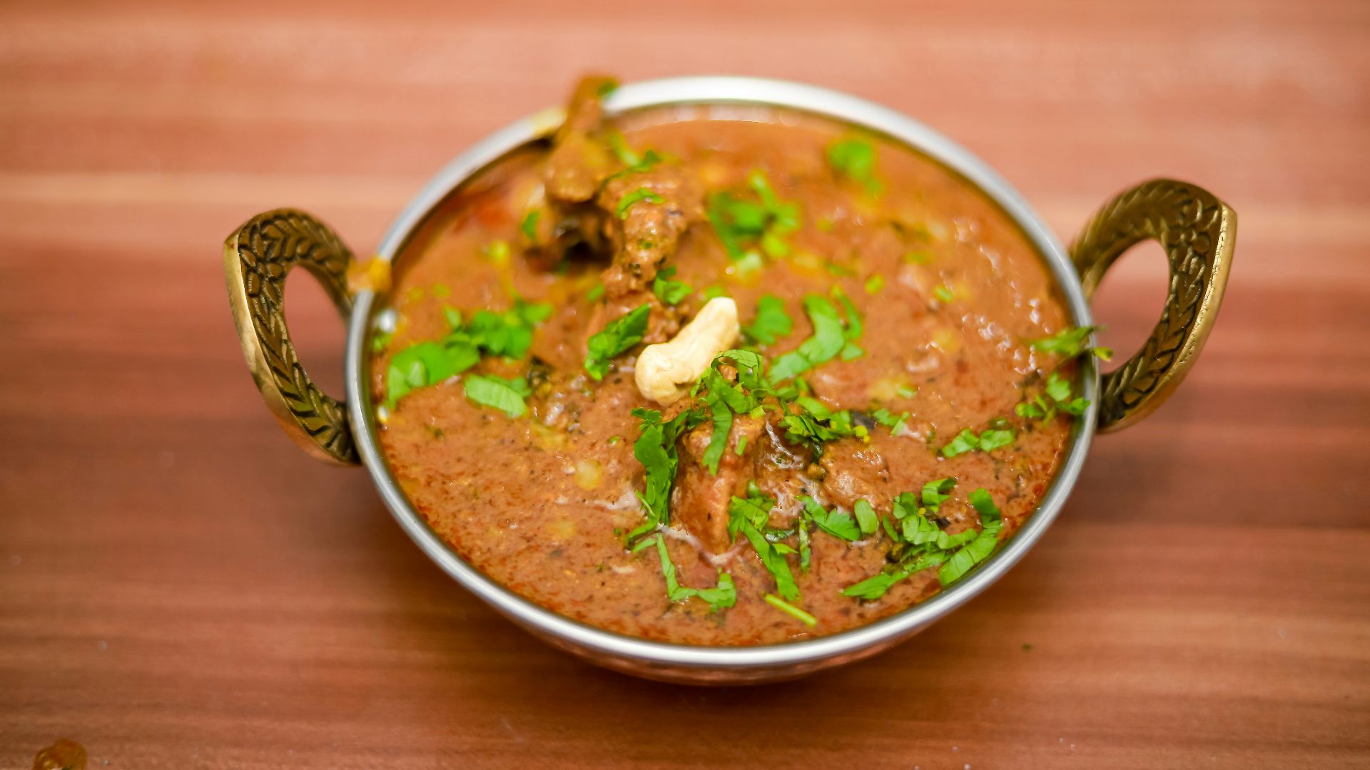 soup with meat in white ceramic bowl