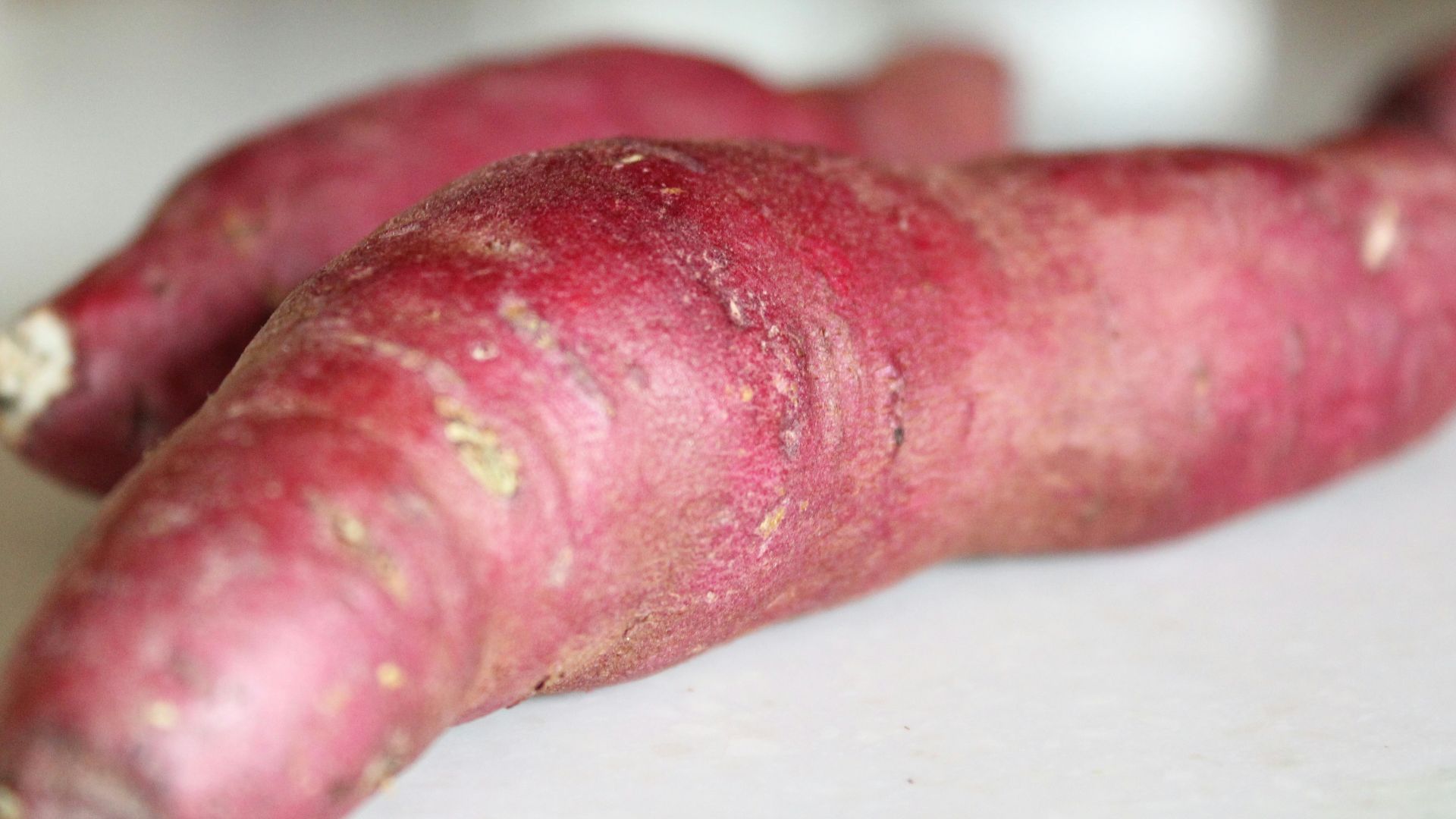 a close up of a purple carrot on a table