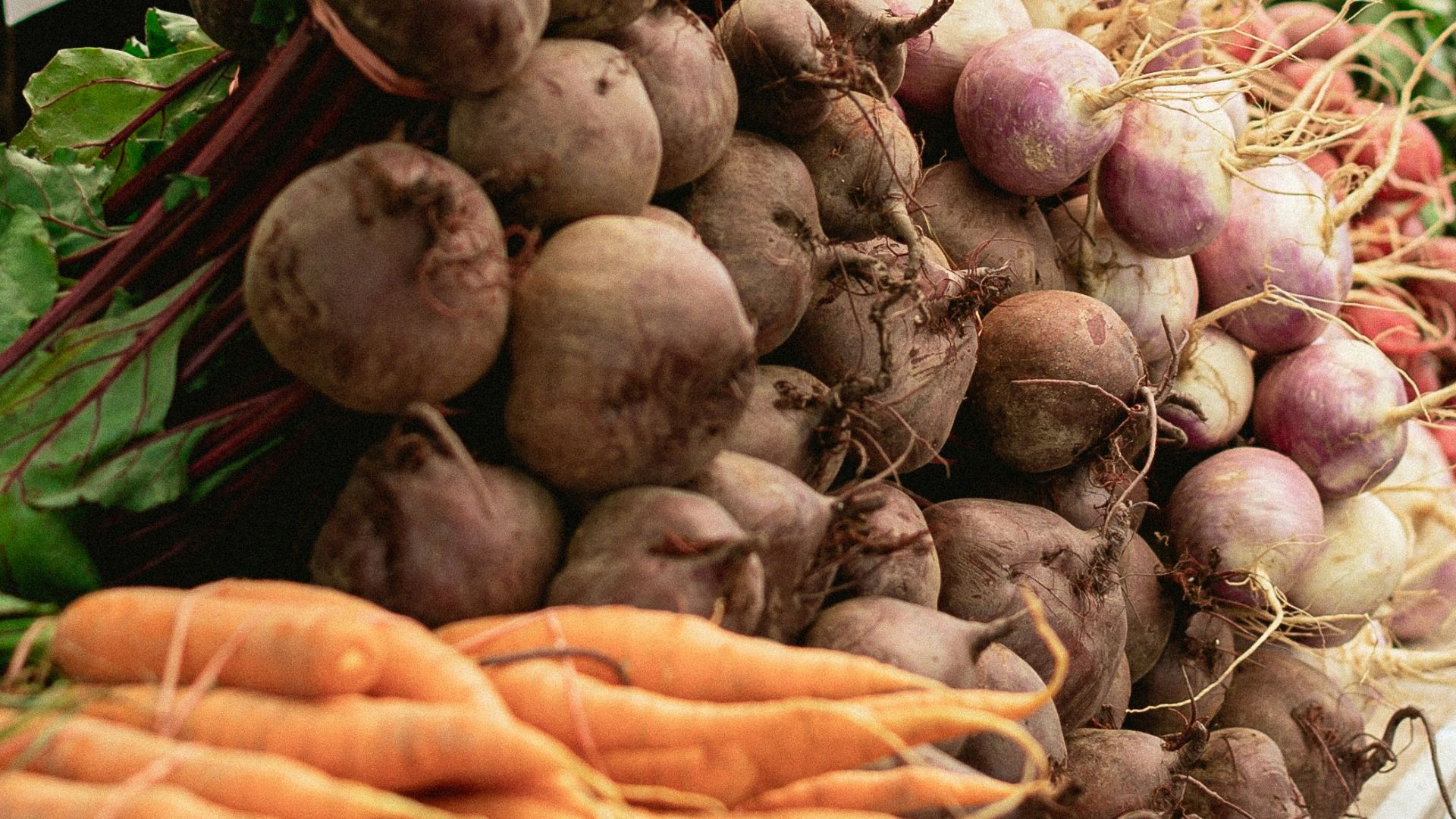 a bunch of carrots and other vegetables on a table