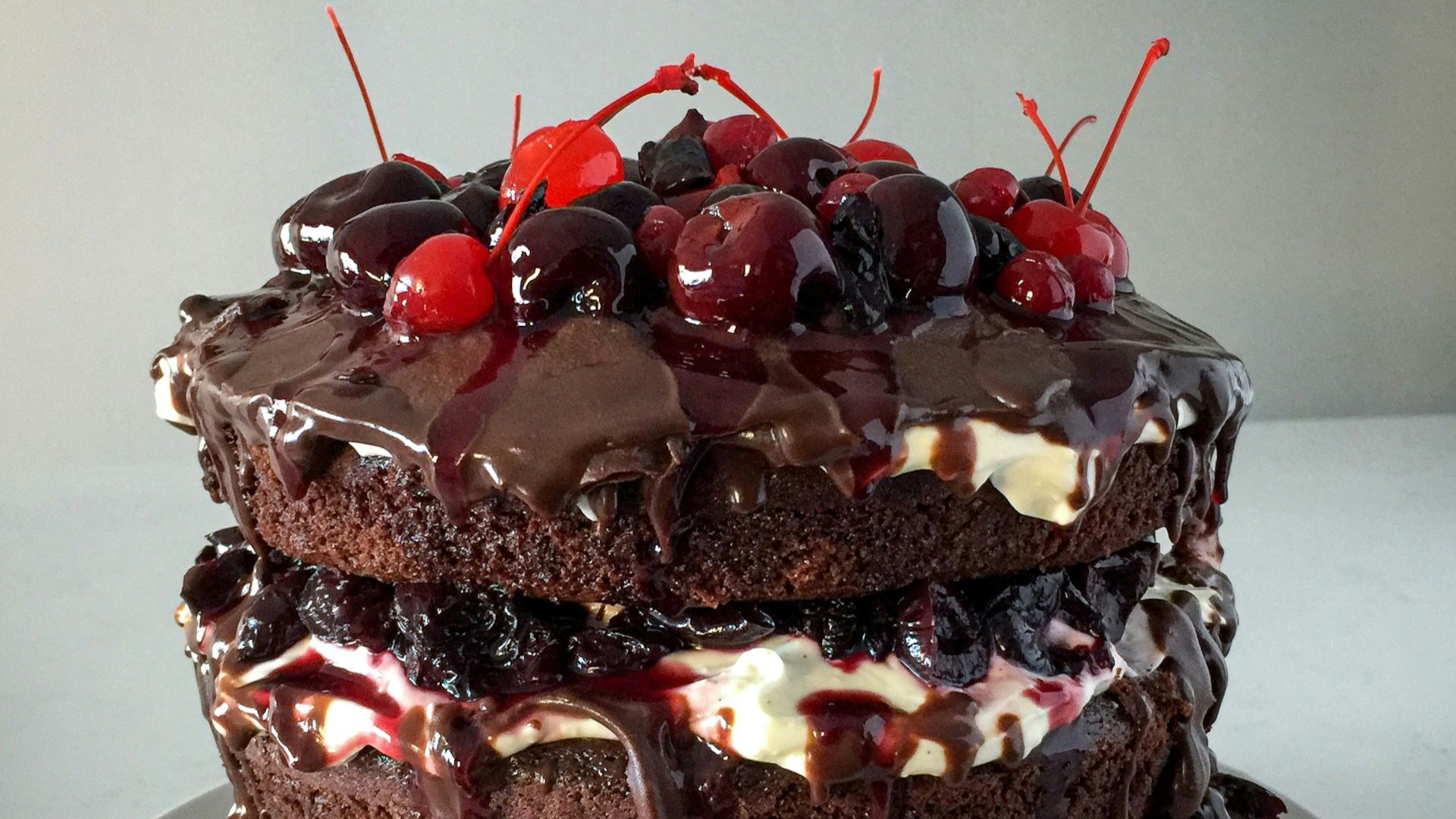 chocolate cake with strawberry on white ceramic plate