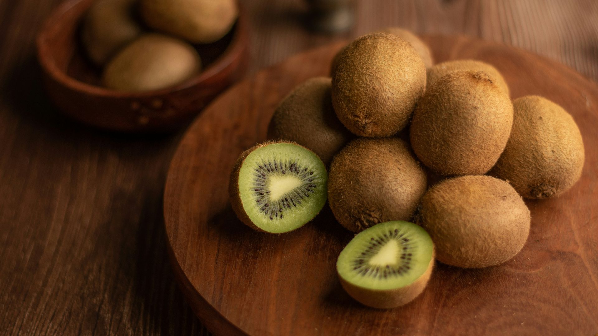 brown round fruit on brown wooden table