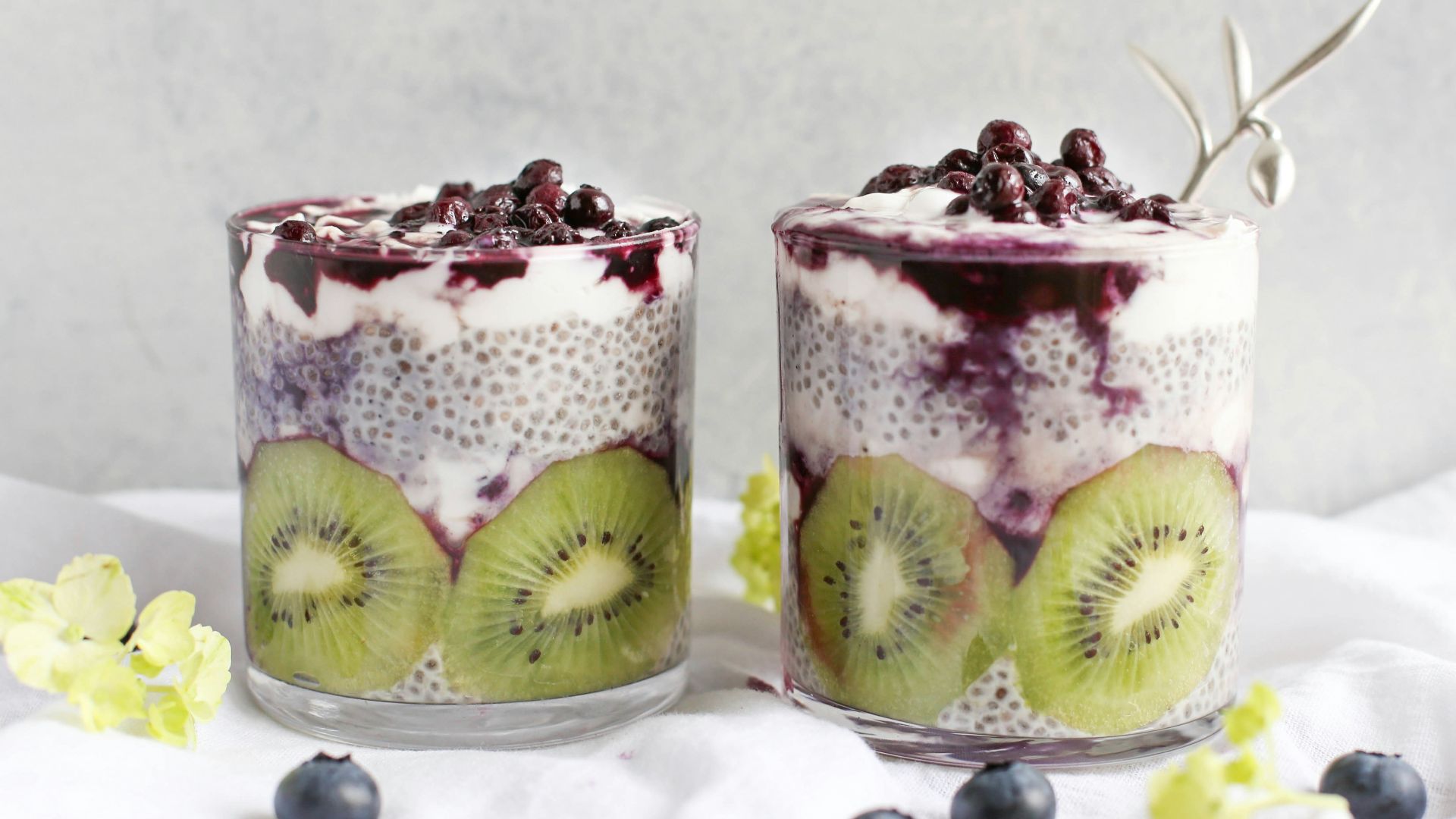 two fruit beverages on glass cups