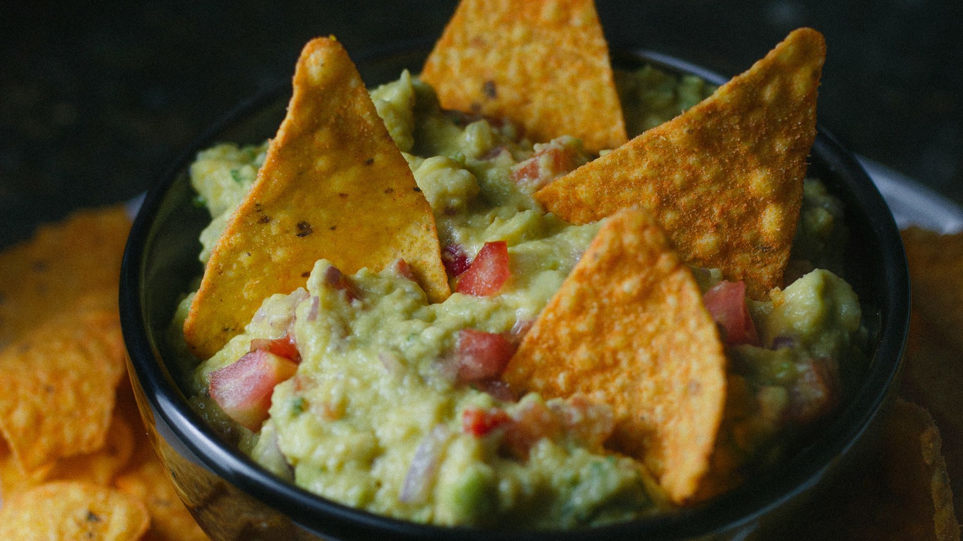 green vegetable on black ceramic bowl