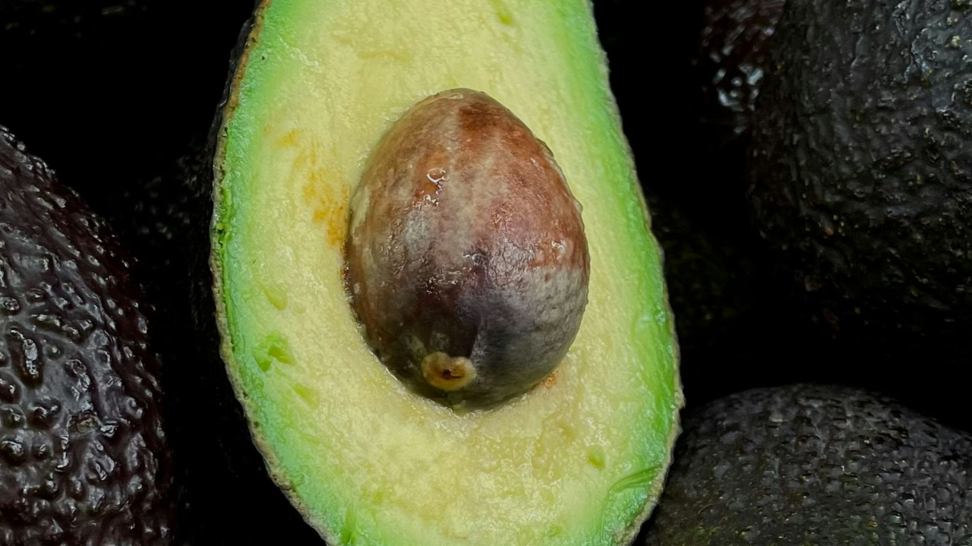 green and brown fruit on black and brown fruits