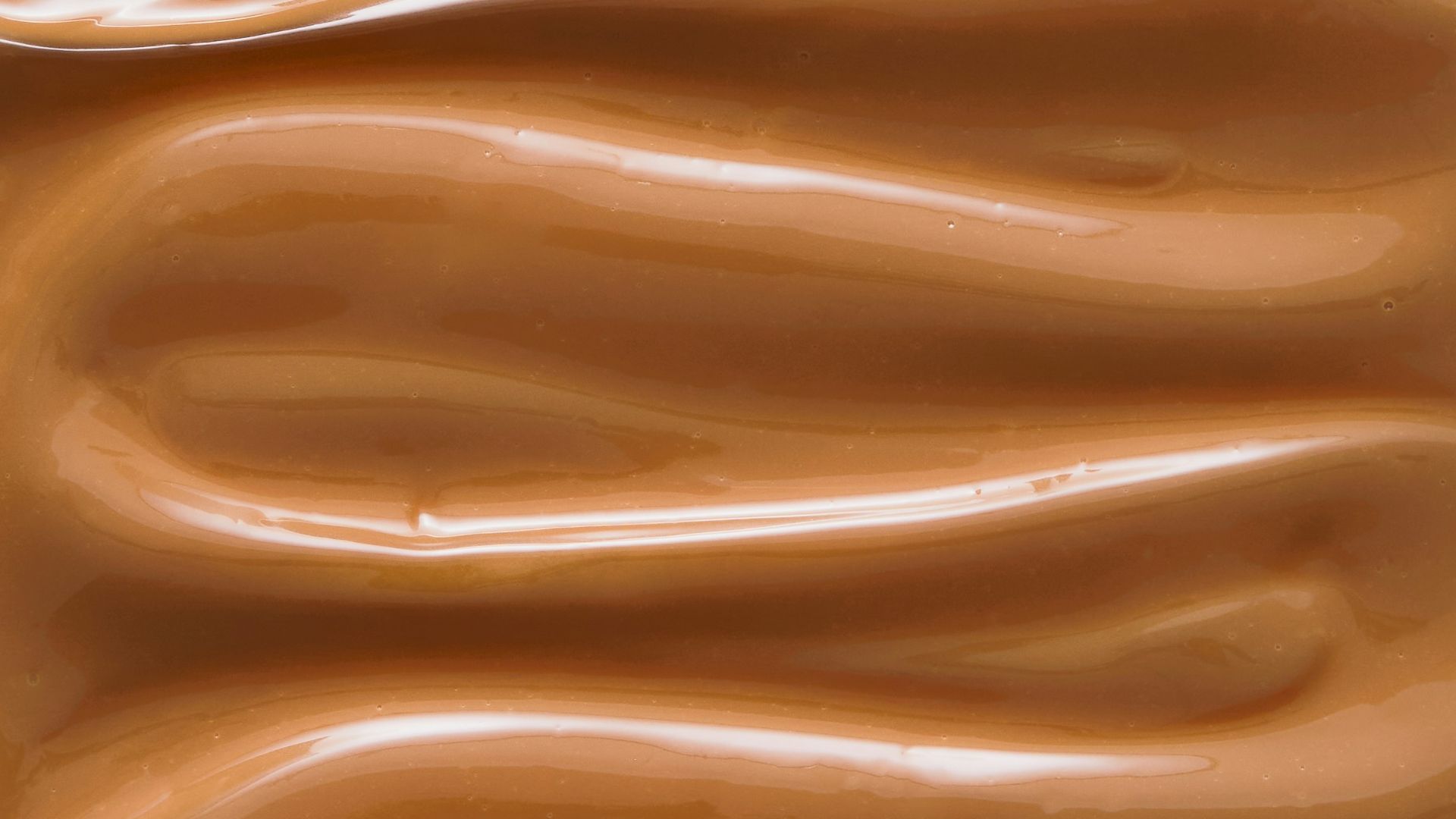 A close up of a chocolate frosted surface