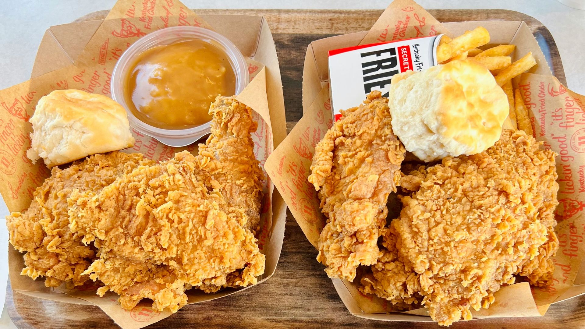 a couple of trays of food on a table