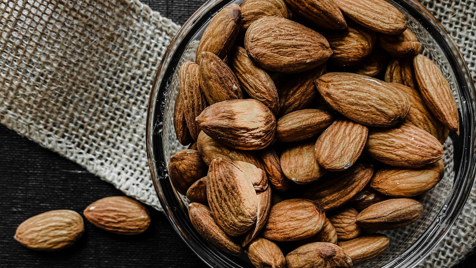 brown almond nuts on stainless steel bowl