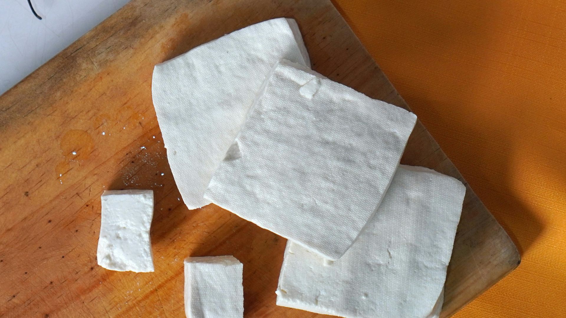 a white napkin on a cutting board