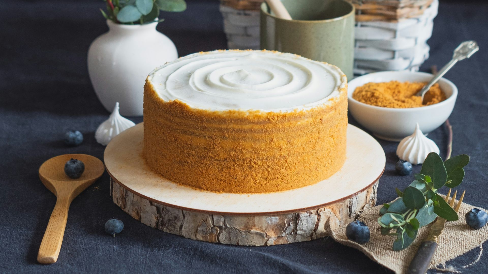 orange fruit on white ceramic plate beside white ceramic cup with saucer