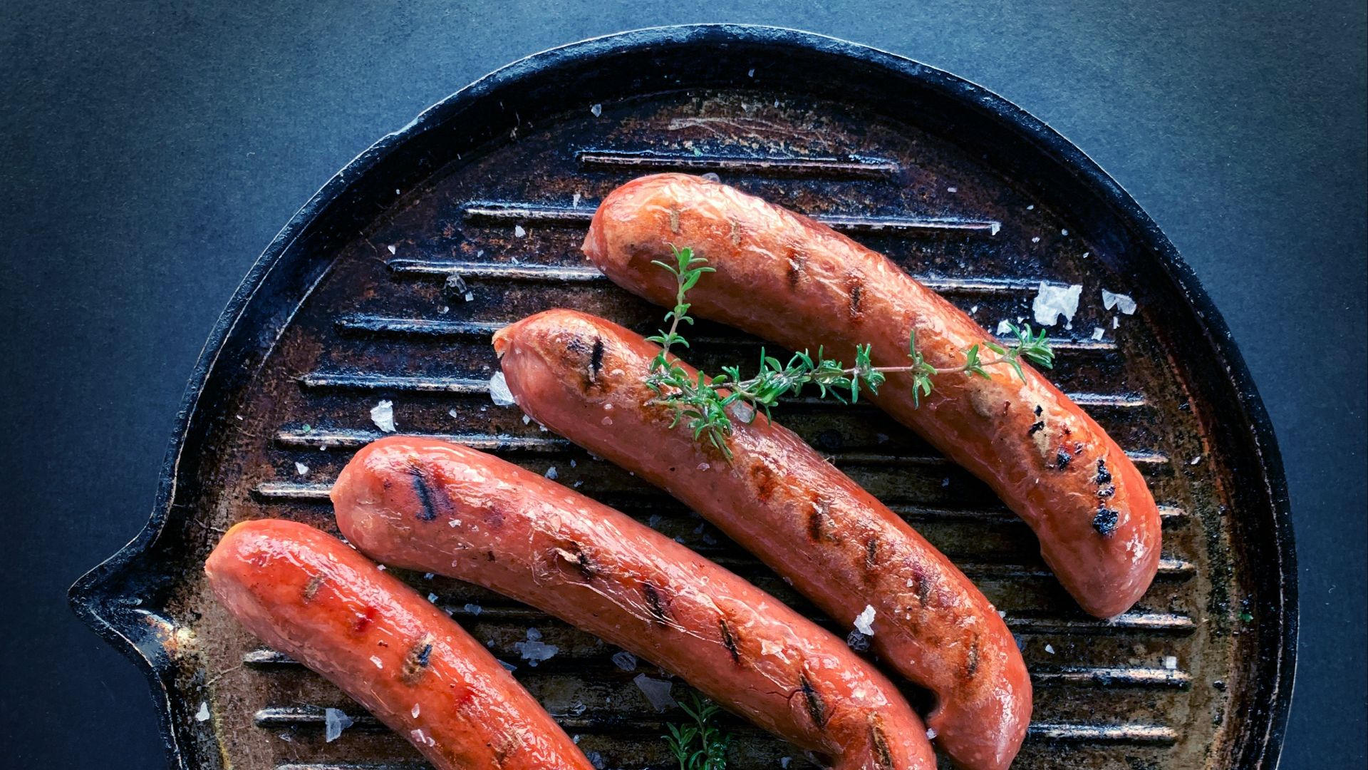 sausage on black round pan