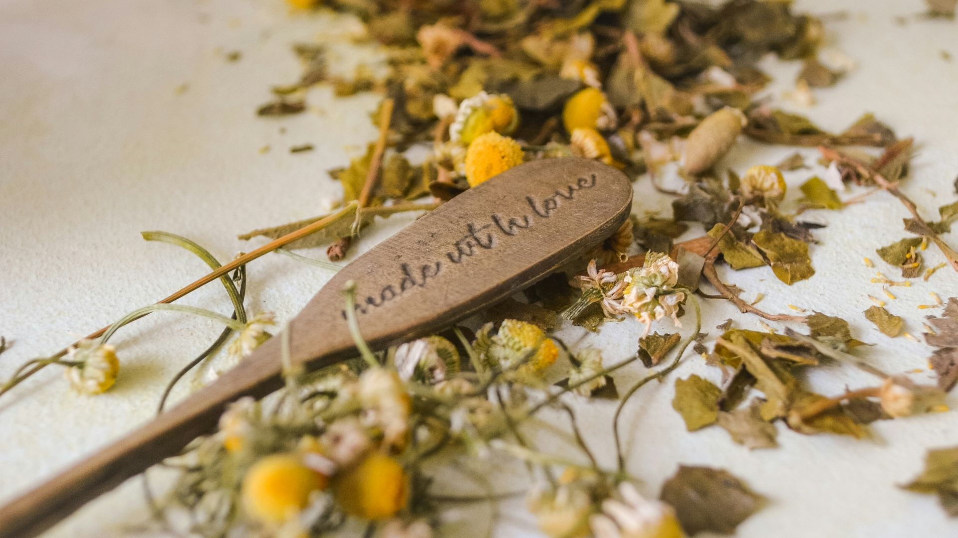 yellow and white flower petals on white ceramic container
