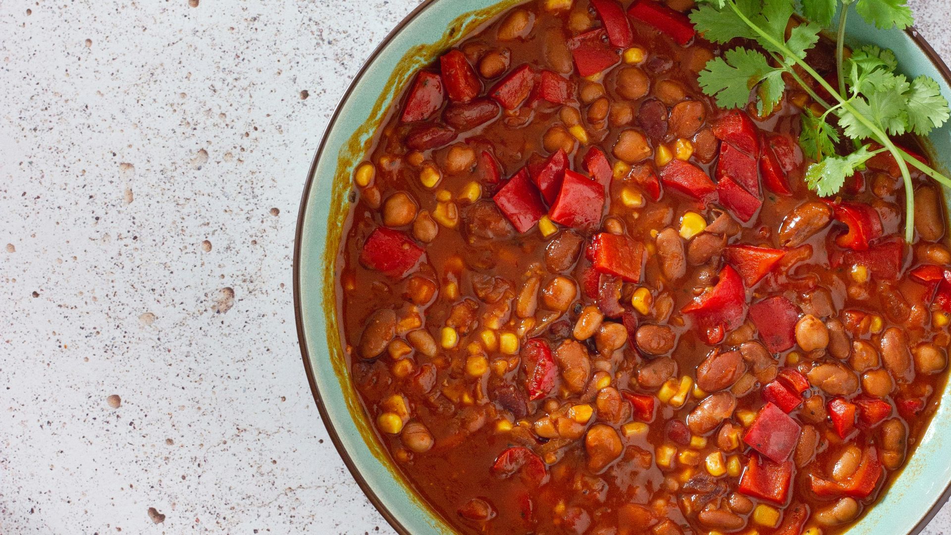 red and green chili peppers in white ceramic bowl