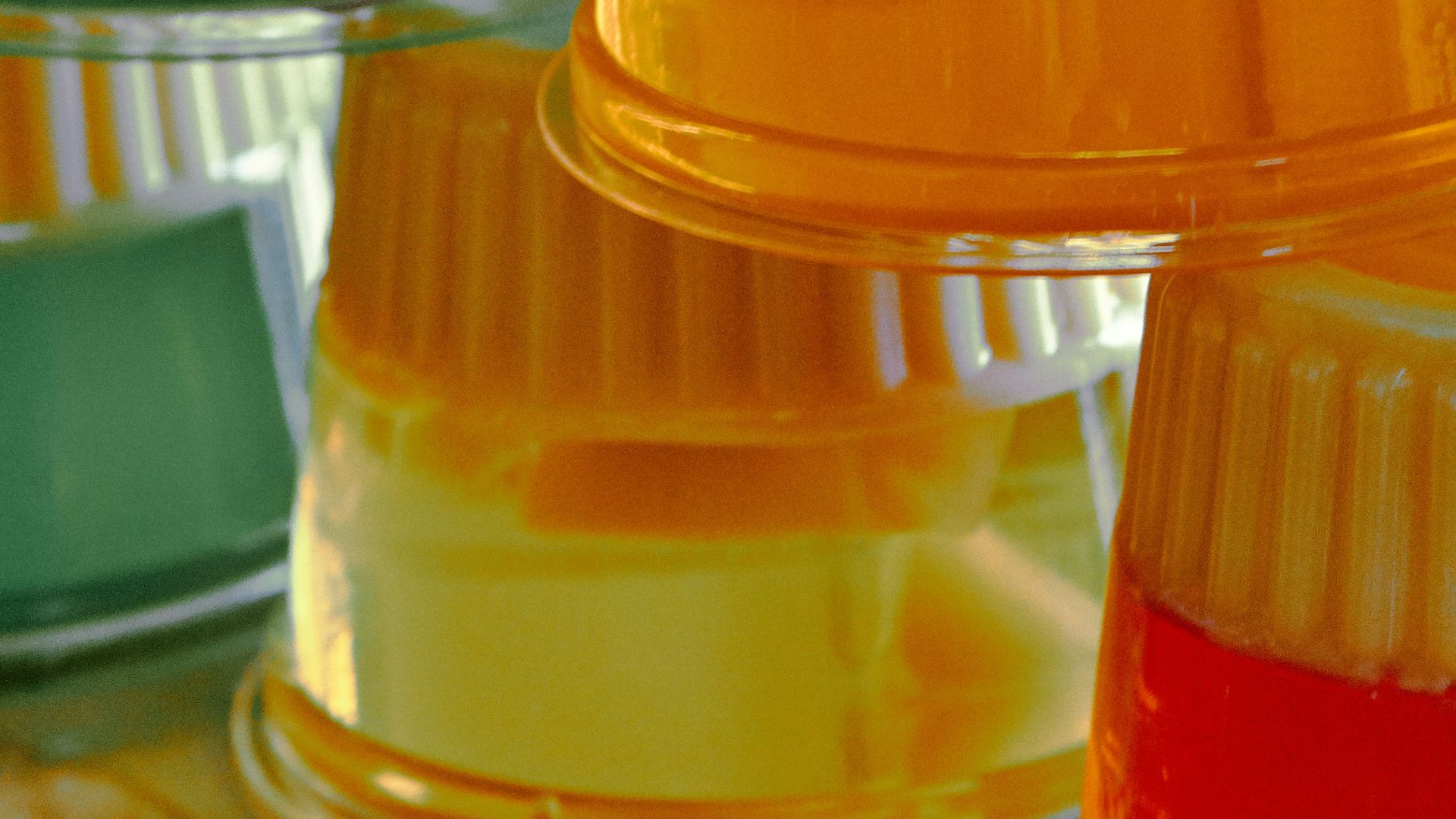 yellow and clear plastic container