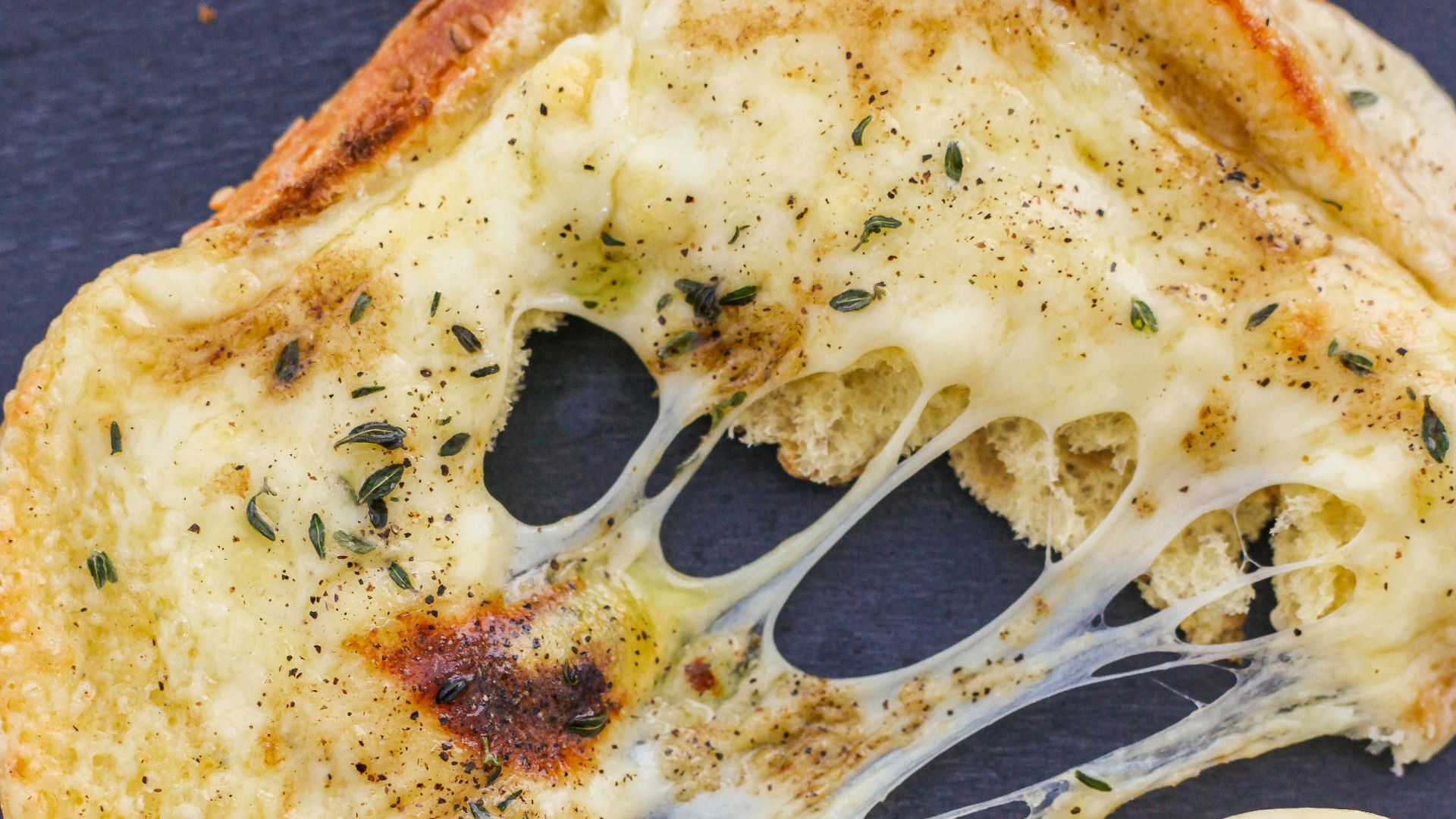 pizza with cheese and green vegetable