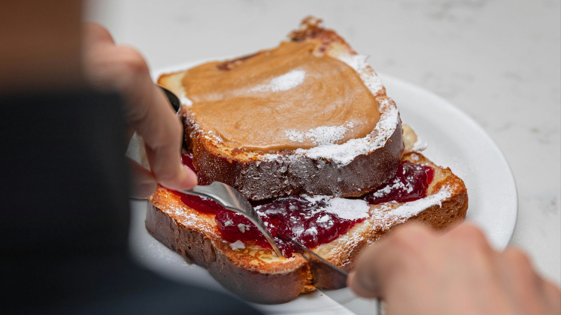 a person eating a sandwich