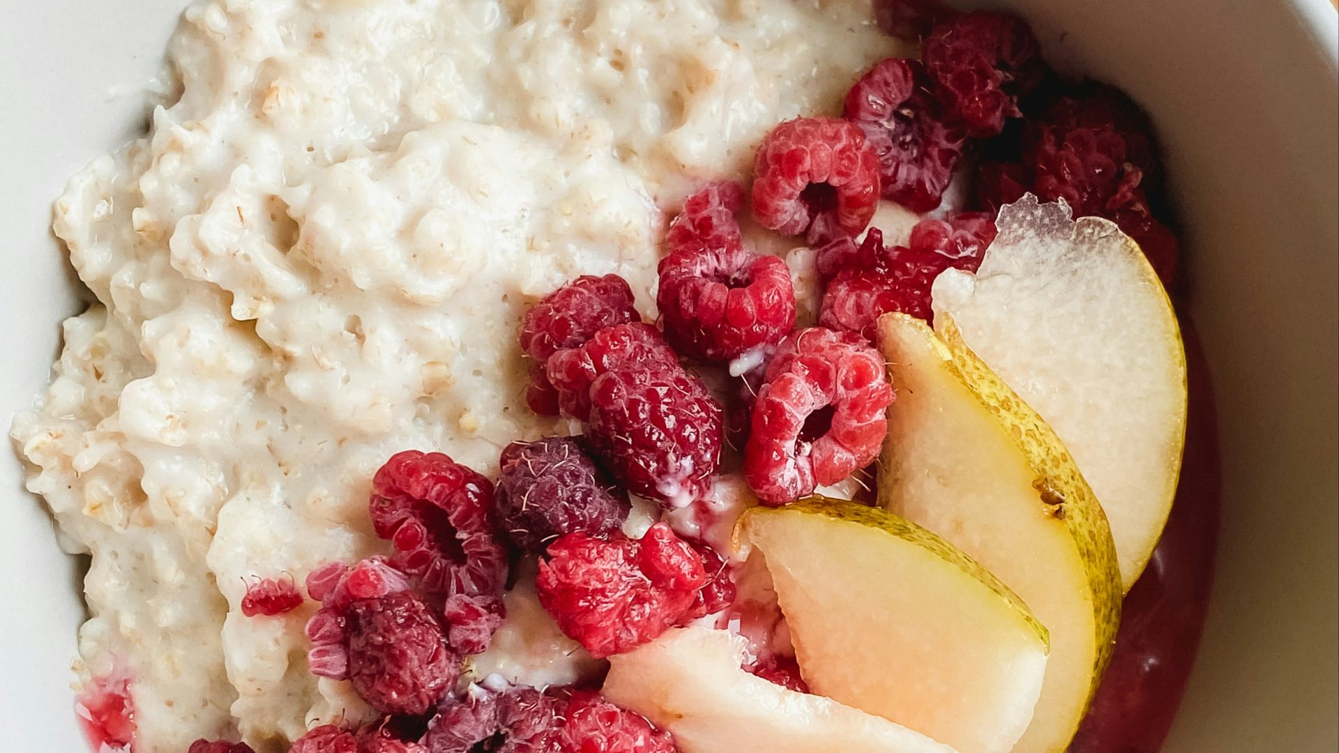 sliced apples and bananas in white ceramic bowl
