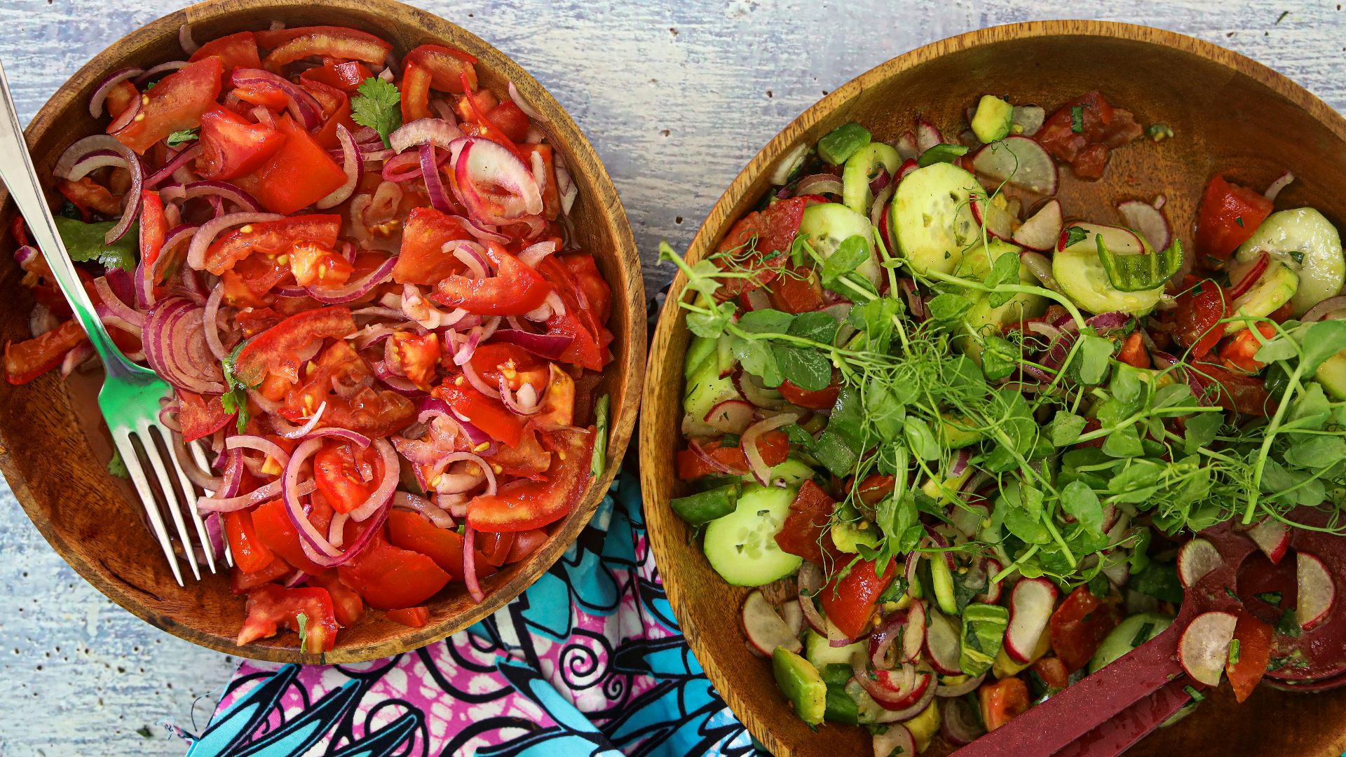 a couple of bowls full of food