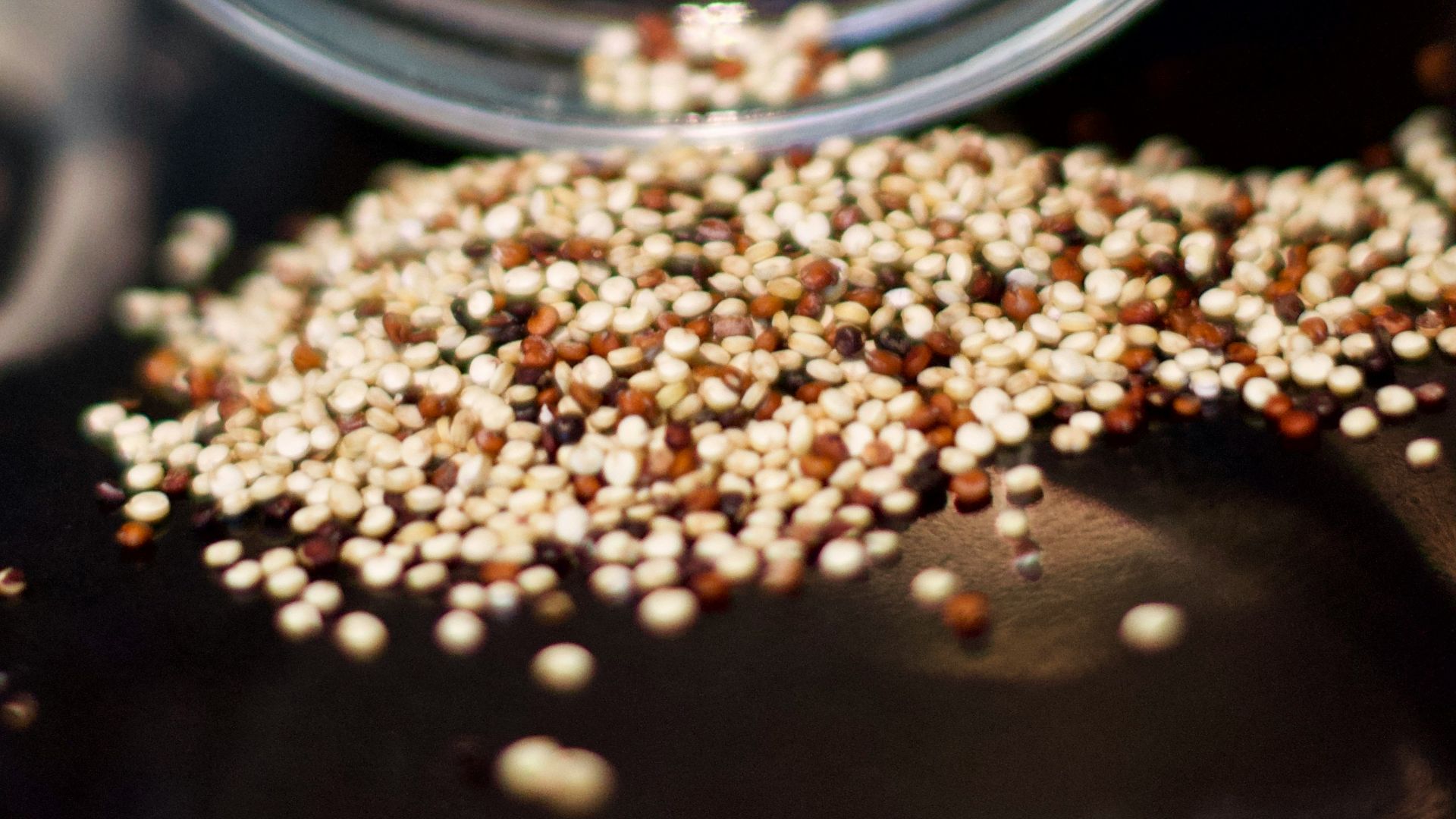 brown coffee beans in clear glass jar