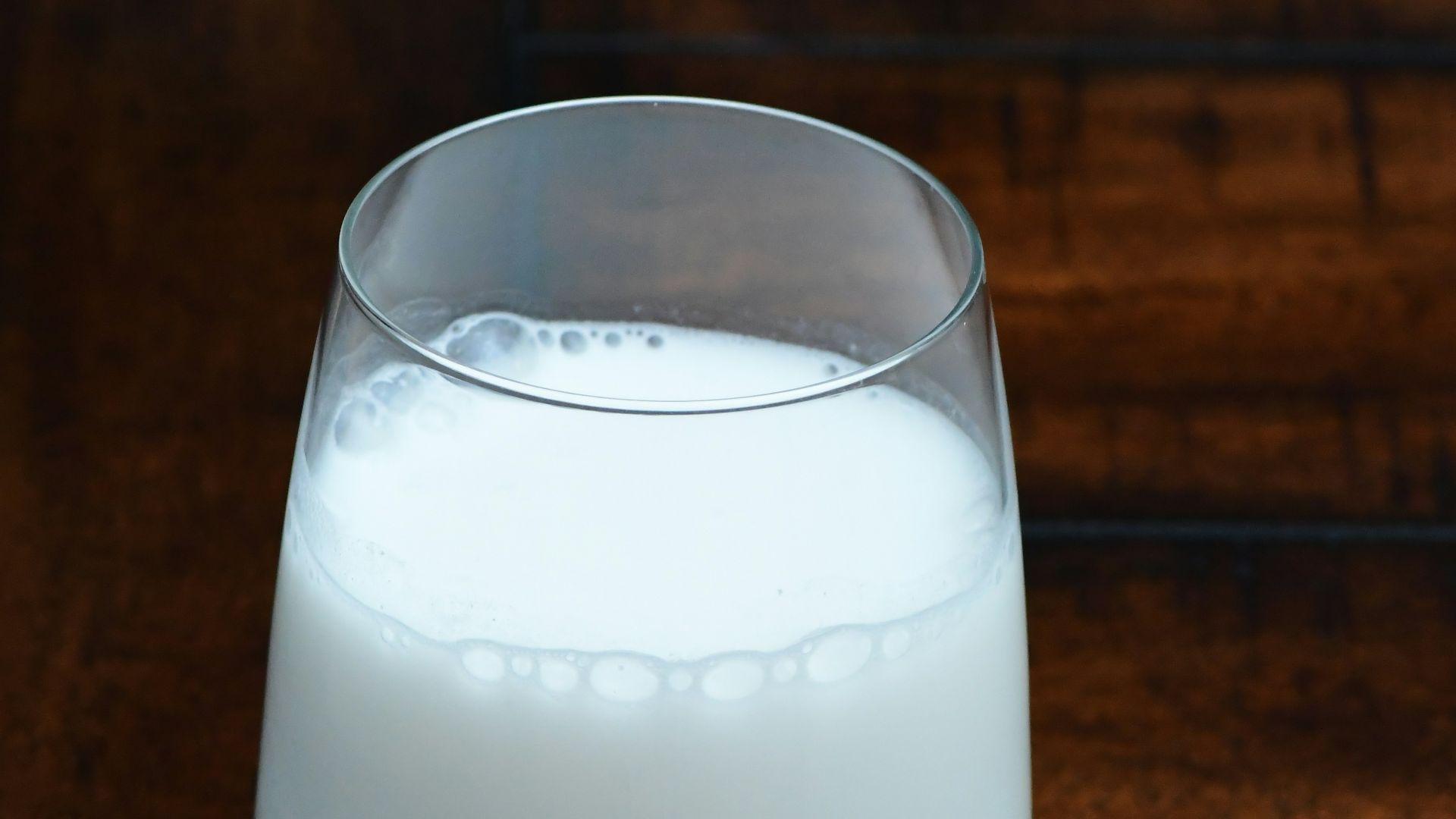 clear drinking glass with white liquid