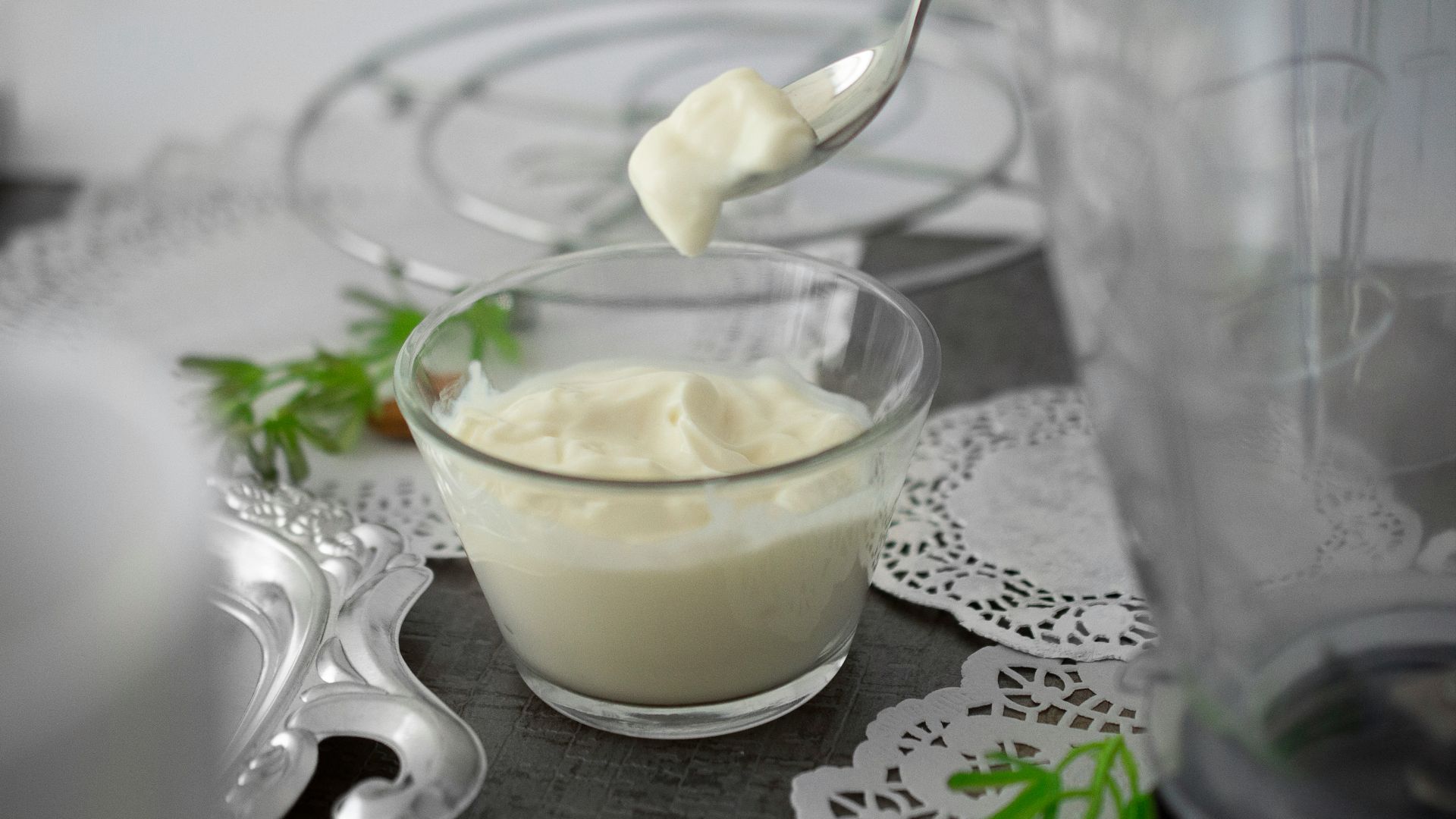 close-up photo of white cream in clear shot glass