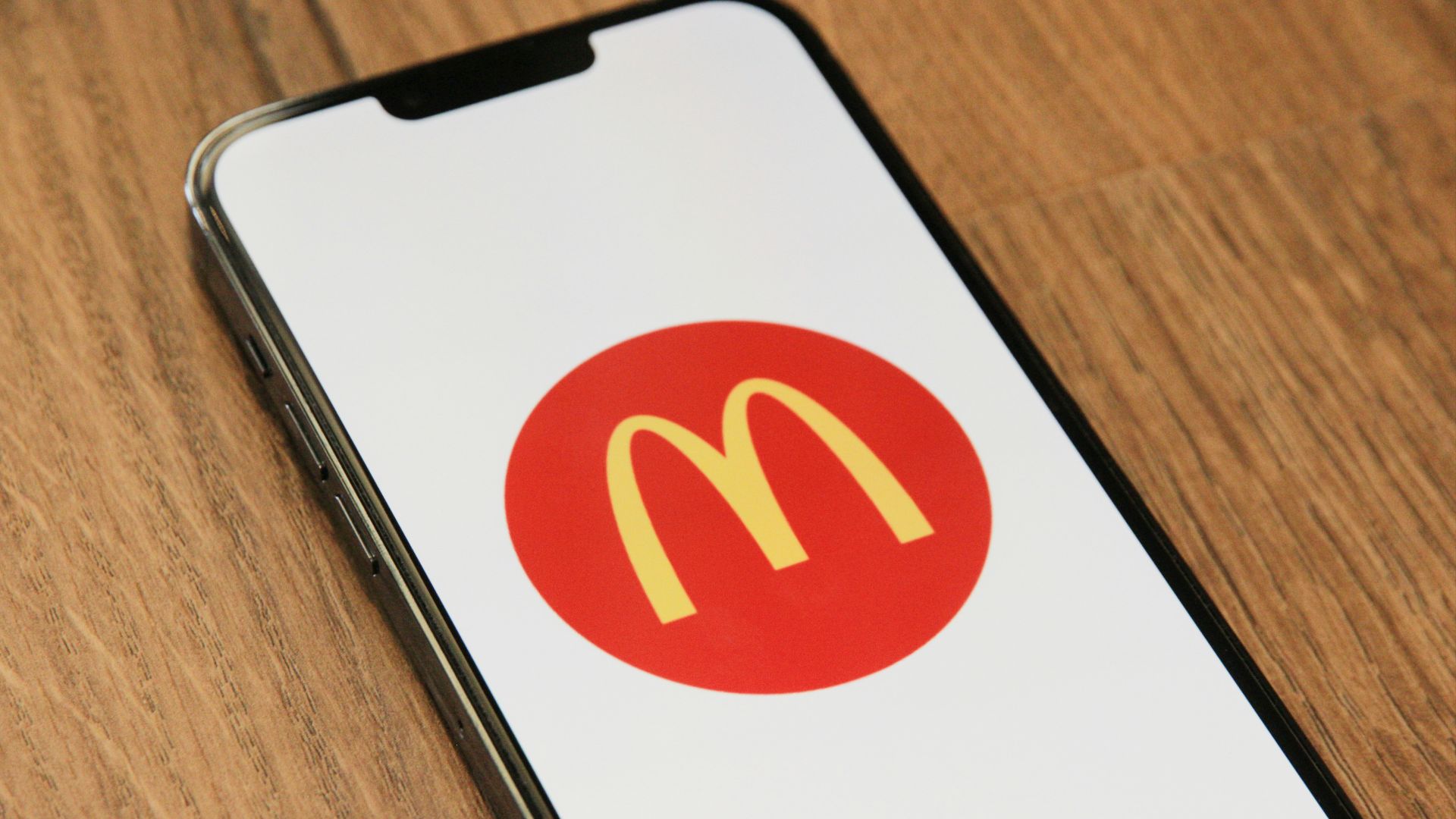 a cell phone with a mcdonald's logo on it