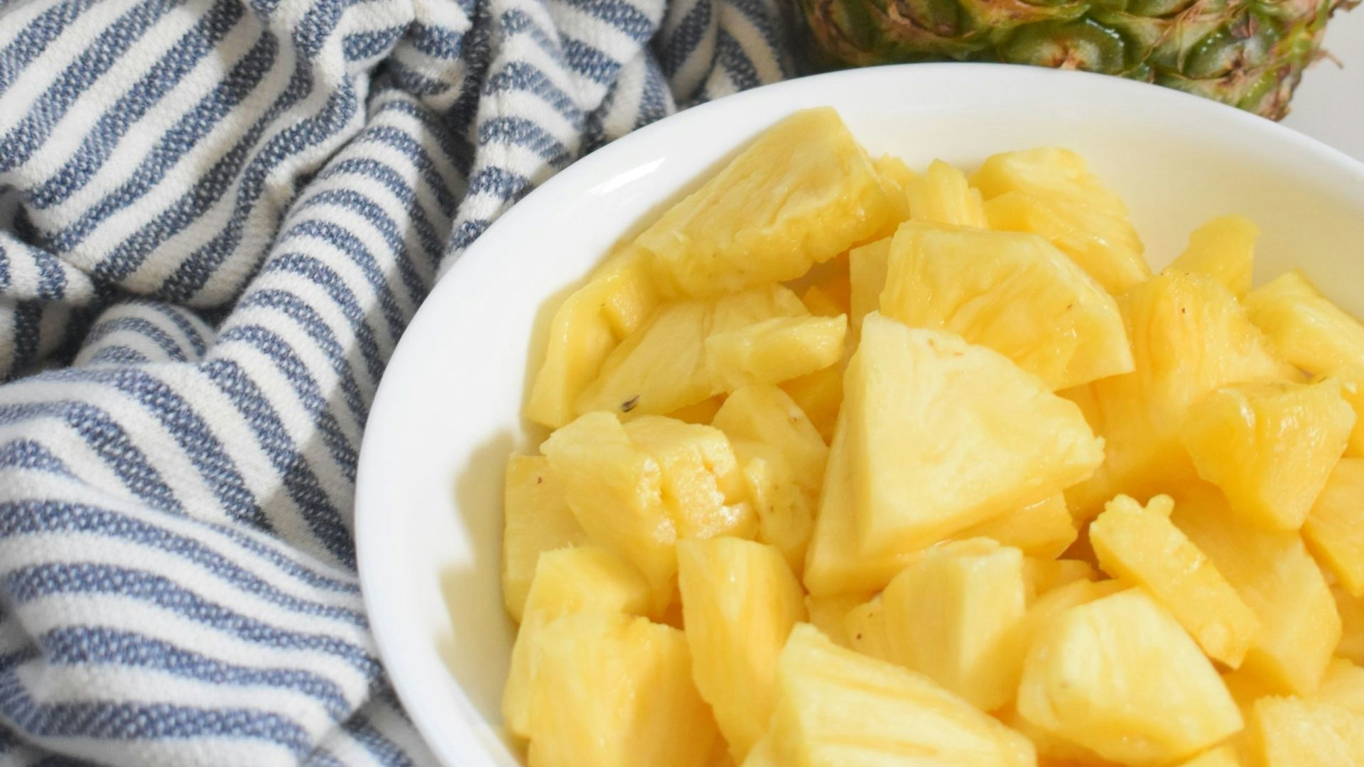 pineapple fruit on white ceramic plate
