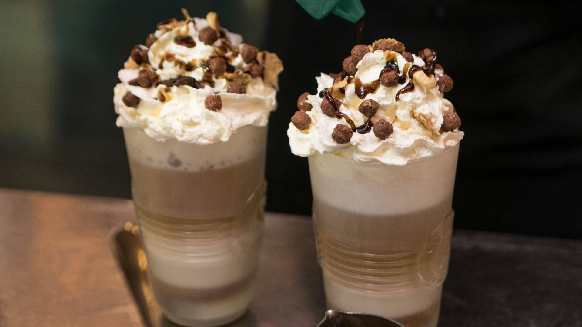 person holding green plastic bottle