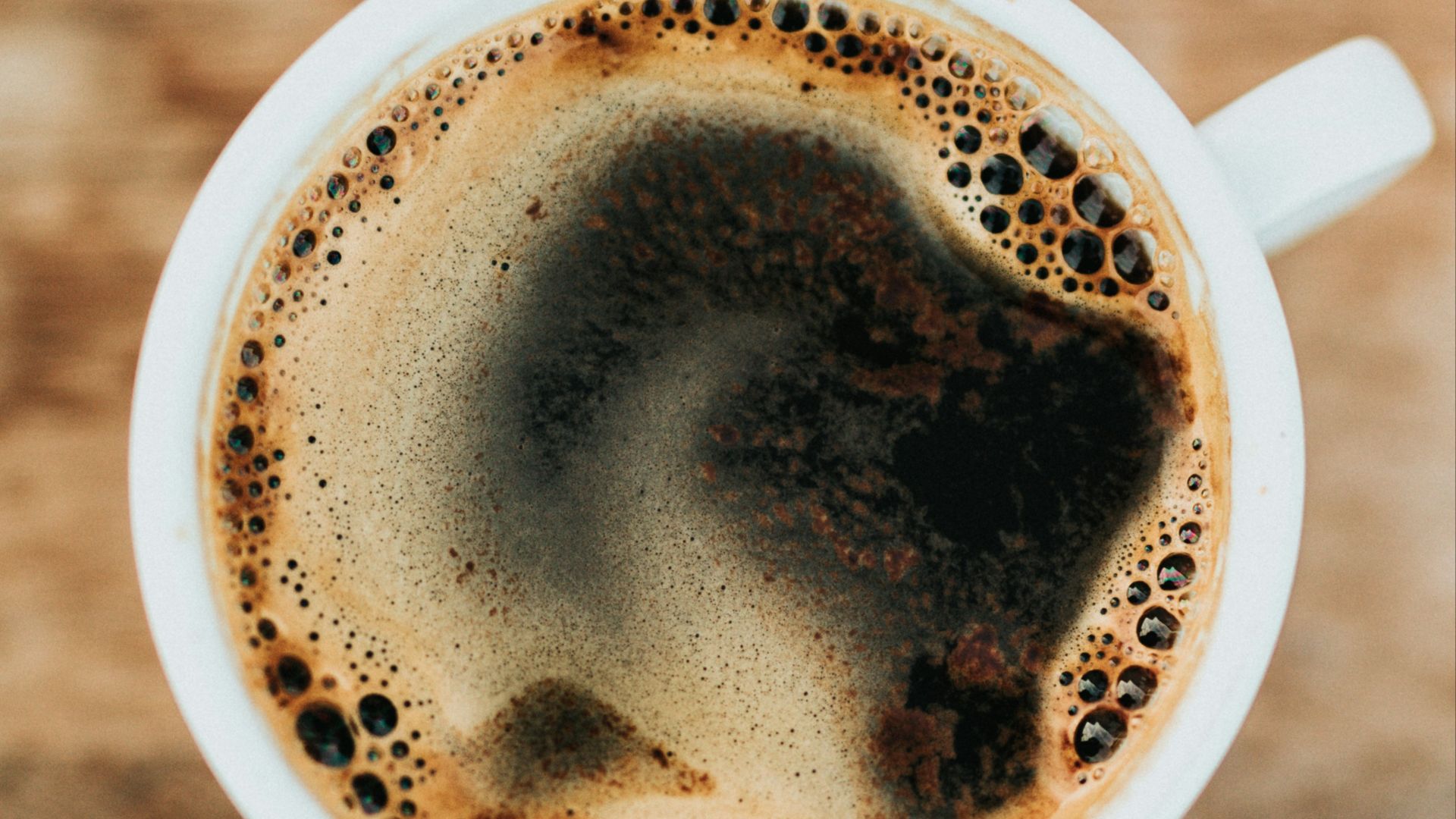 white ceramic mug filled with coffee