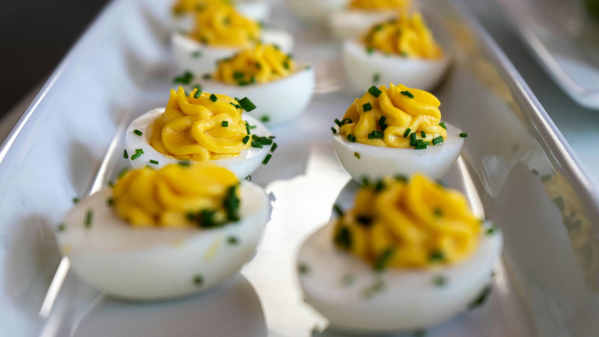 white and yellow icing covered cupcakes
