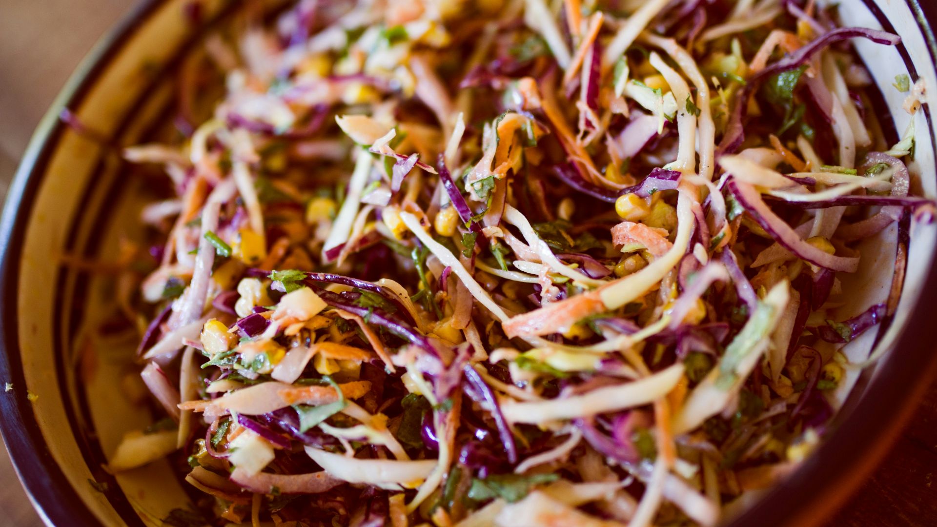 vegetable salad on white and black ceramic bowl