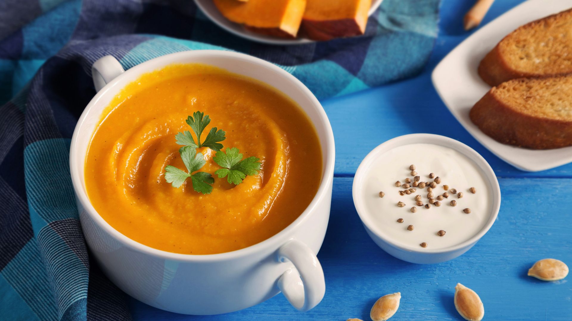 a cup of tea next to a plate of pastries
