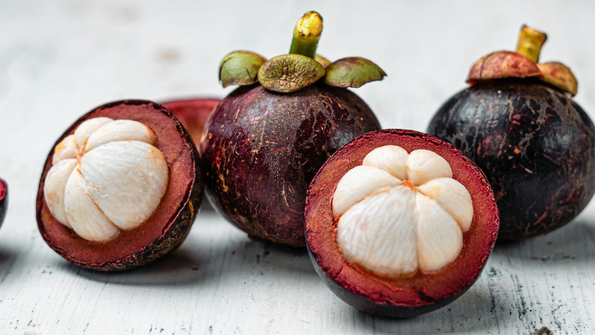 red round fruit on white table